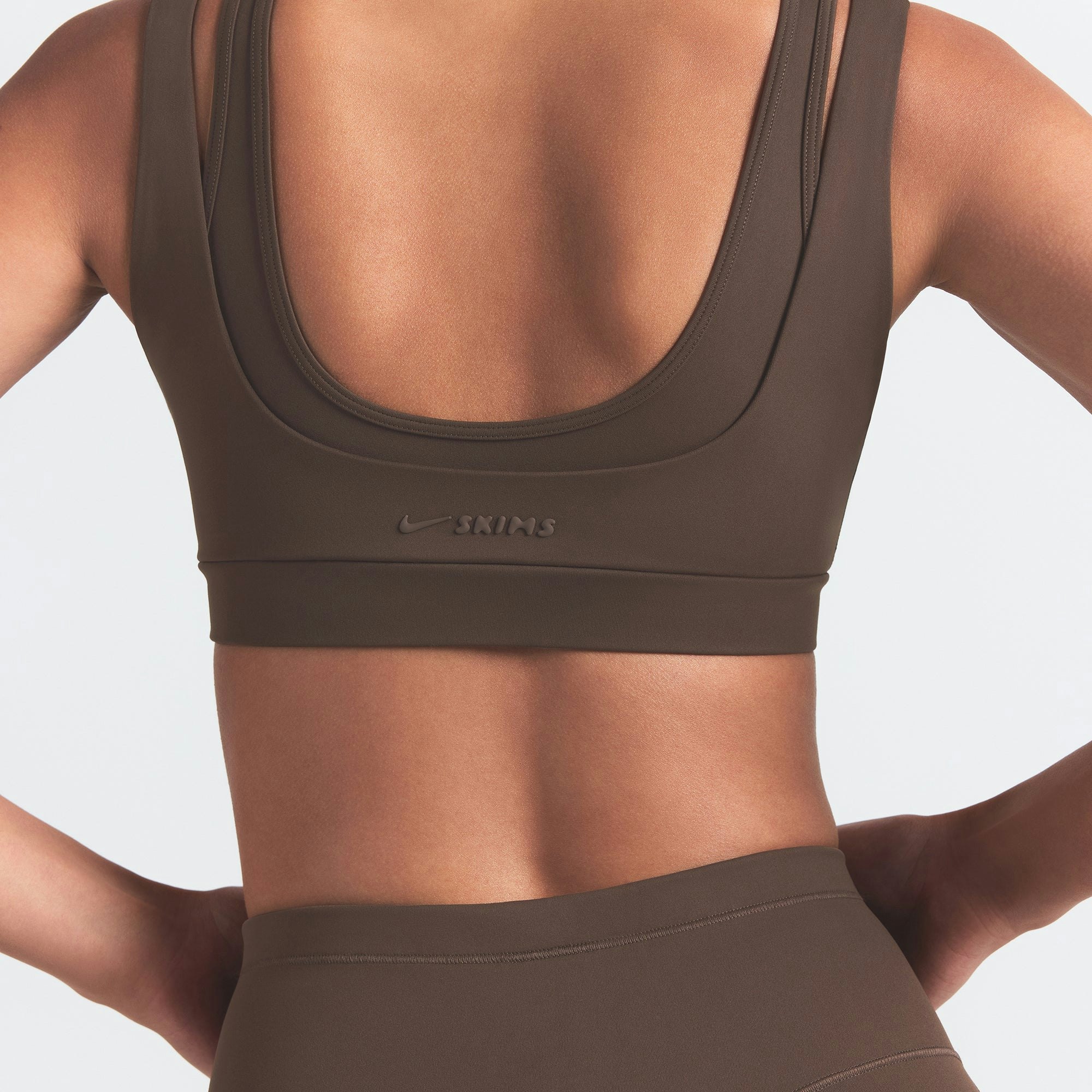 NikeSKIMS MATTE DOUBLE STRAP SCOOP BRA | DARK SEPIA ON A MODEL BACK VIEW