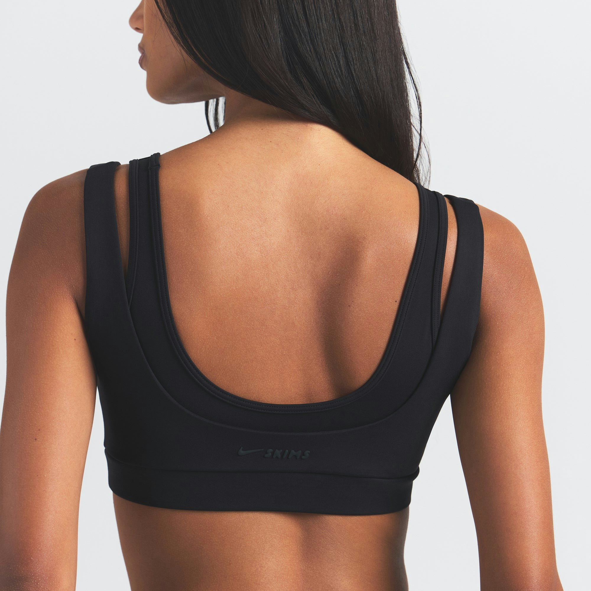 NikeSKIMS MATTE DOUBLE STRAP SCOOP BRA | OBSIDIAN ON A MODEL BACK VIEW