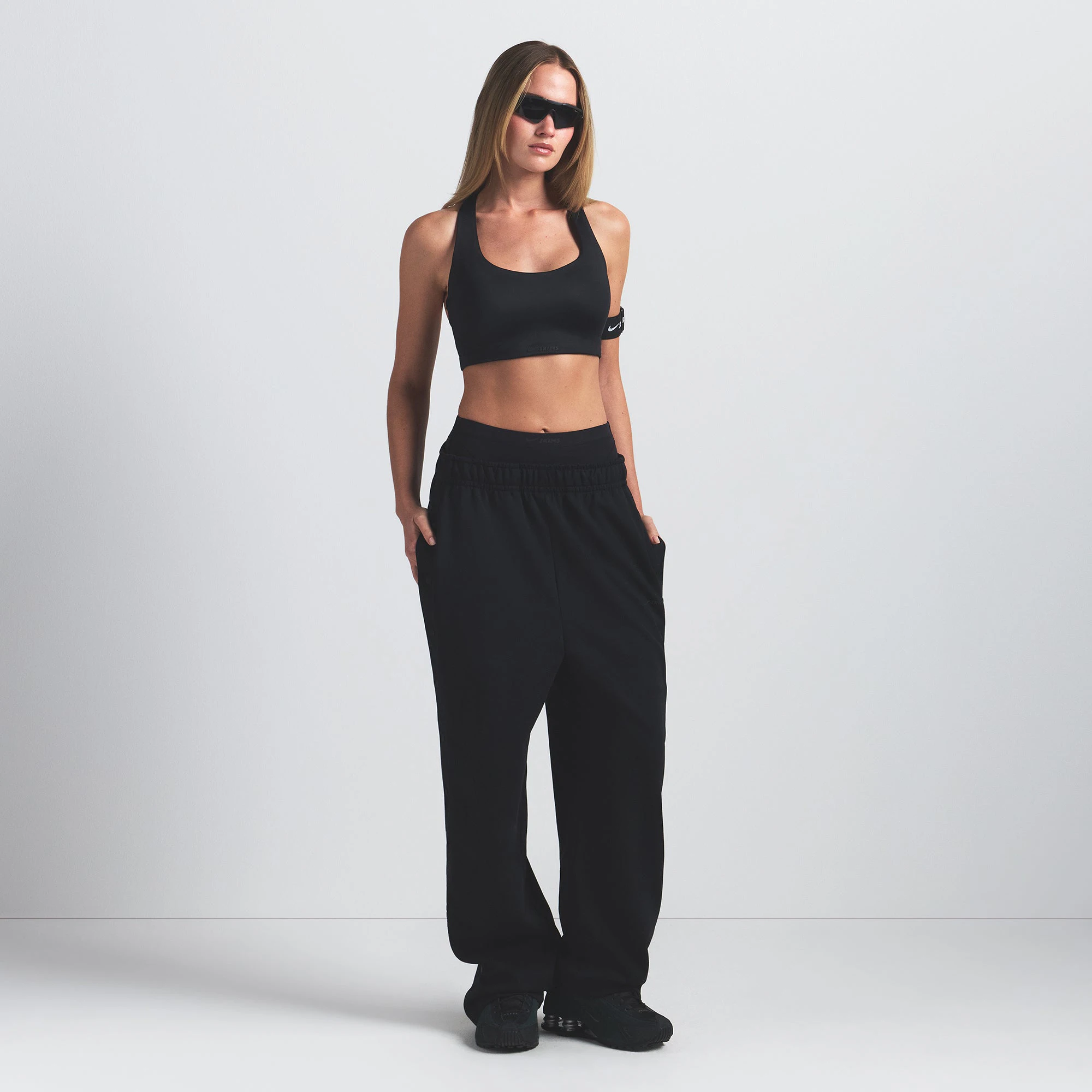 NikeSKIMS SHINE RACER BACK BRA | OBSIDIAN ON A MODEL FRONT VIEW @ | FOCUS: 0.9, 0.1, 0.7