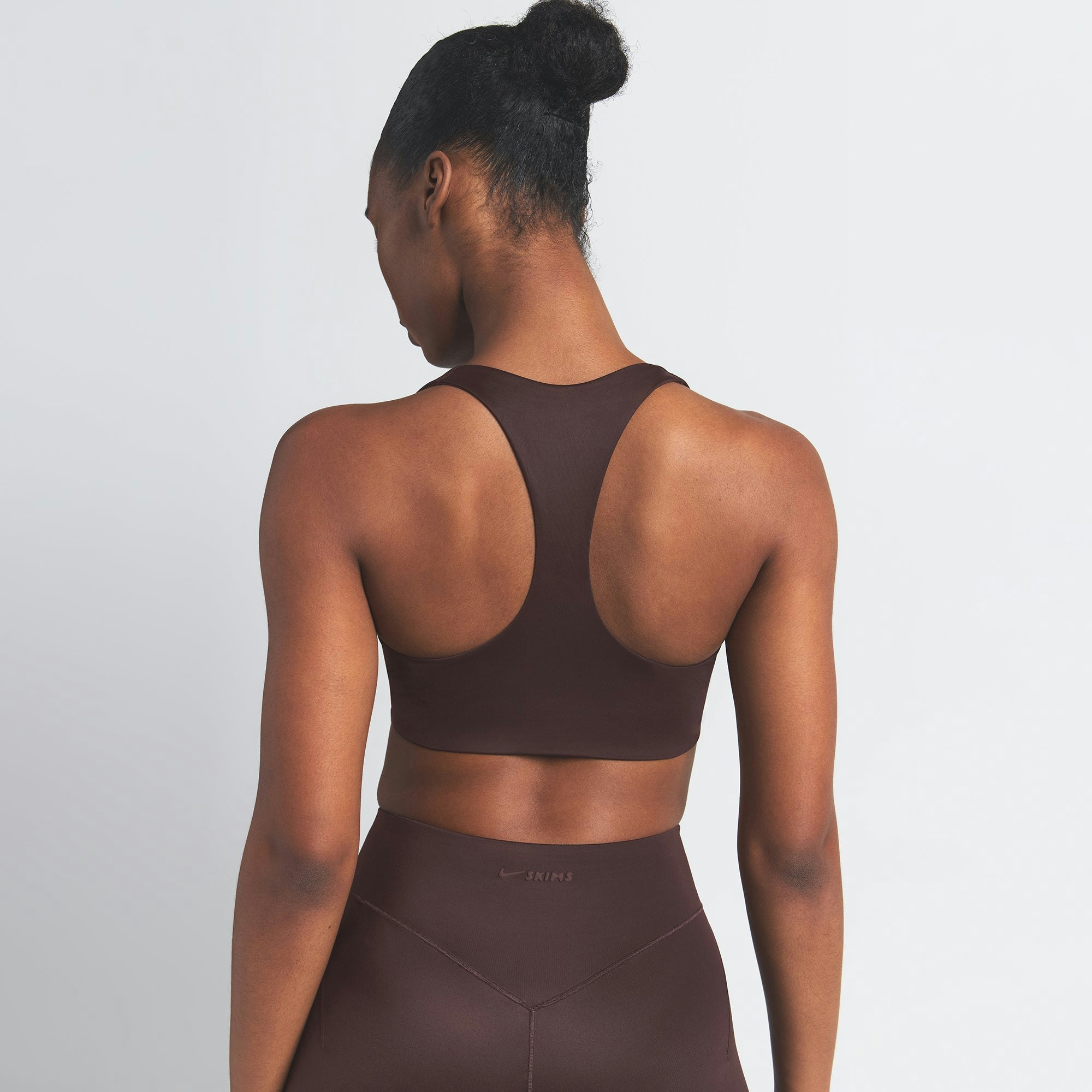 NikeSKIMS SHINE RACER BACK BRA | PHOENIX ON A MODEL SIDE VIEW