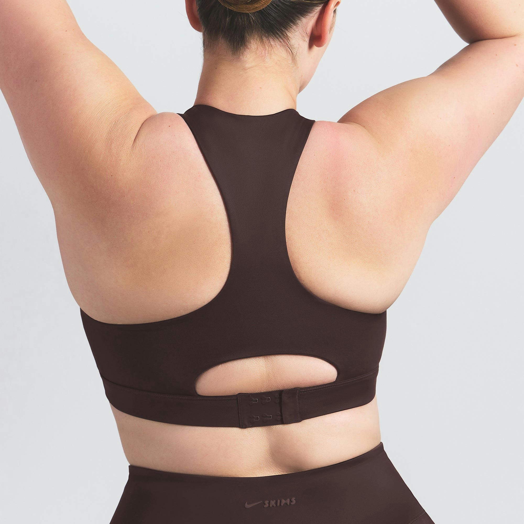 NikeSKIMS SHINE HIGH NECK BRA | PHOENIX ON A MODEL SIDE VIEW