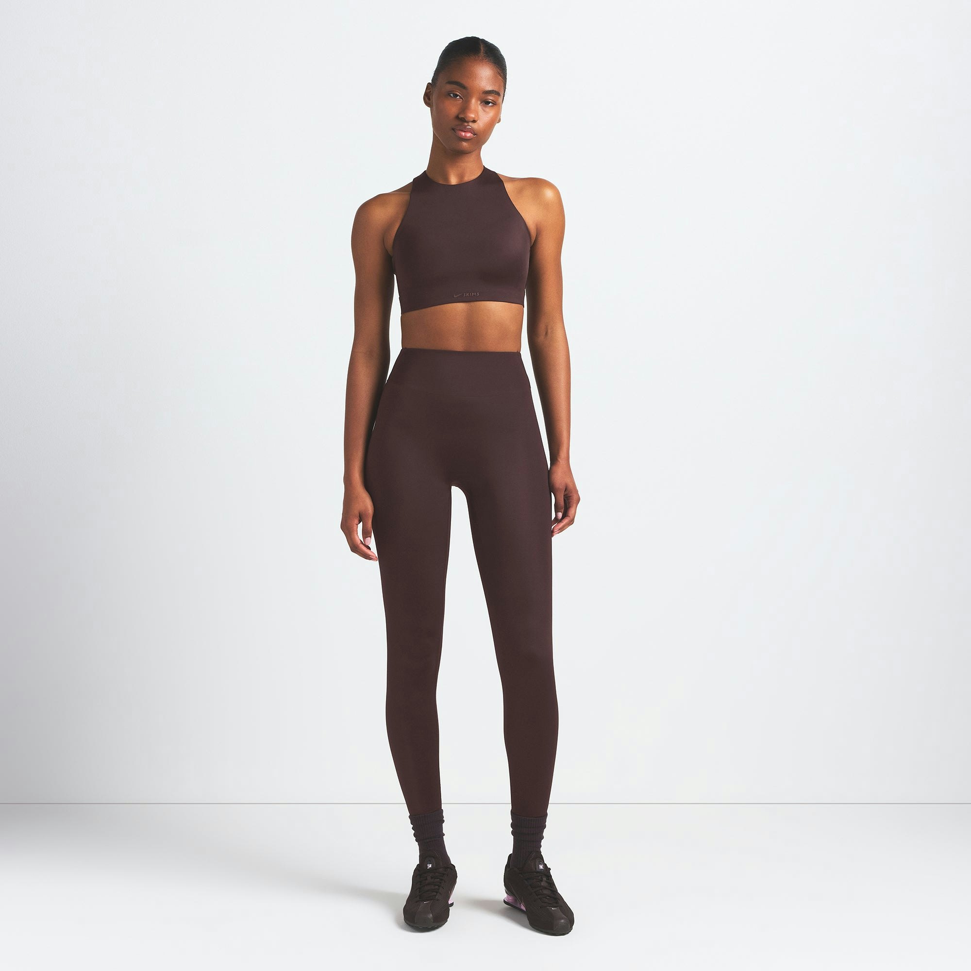 NikeSKIMS SHINE HIGH NECK BRA | PHOENIX ON A MODEL FRONT VIEW @ | FOCUS: 0.9, 0.1, 0.7