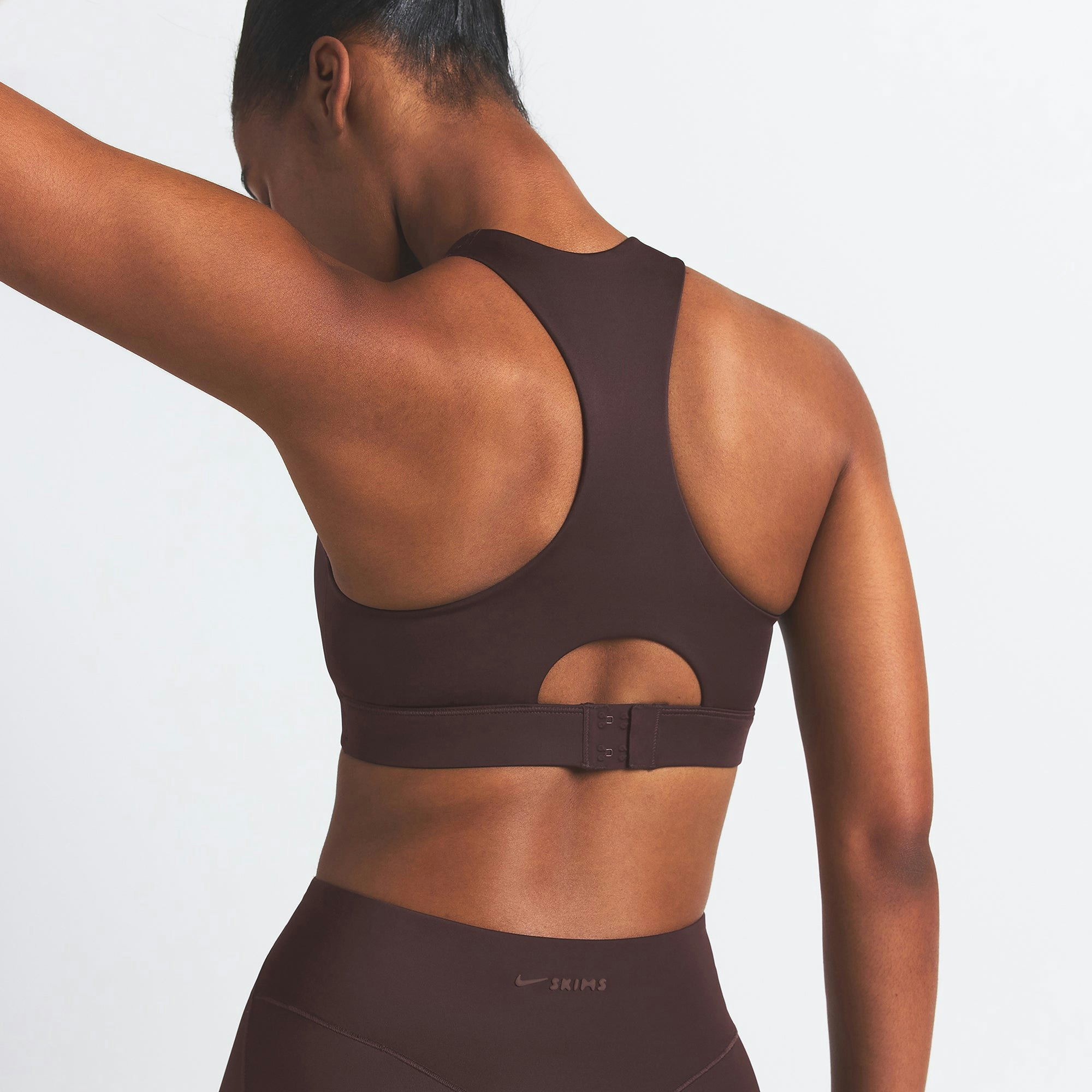 NikeSKIMS SHINE HIGH NECK BRA | PHOENIX ON A MODEL SIDE VIEW
