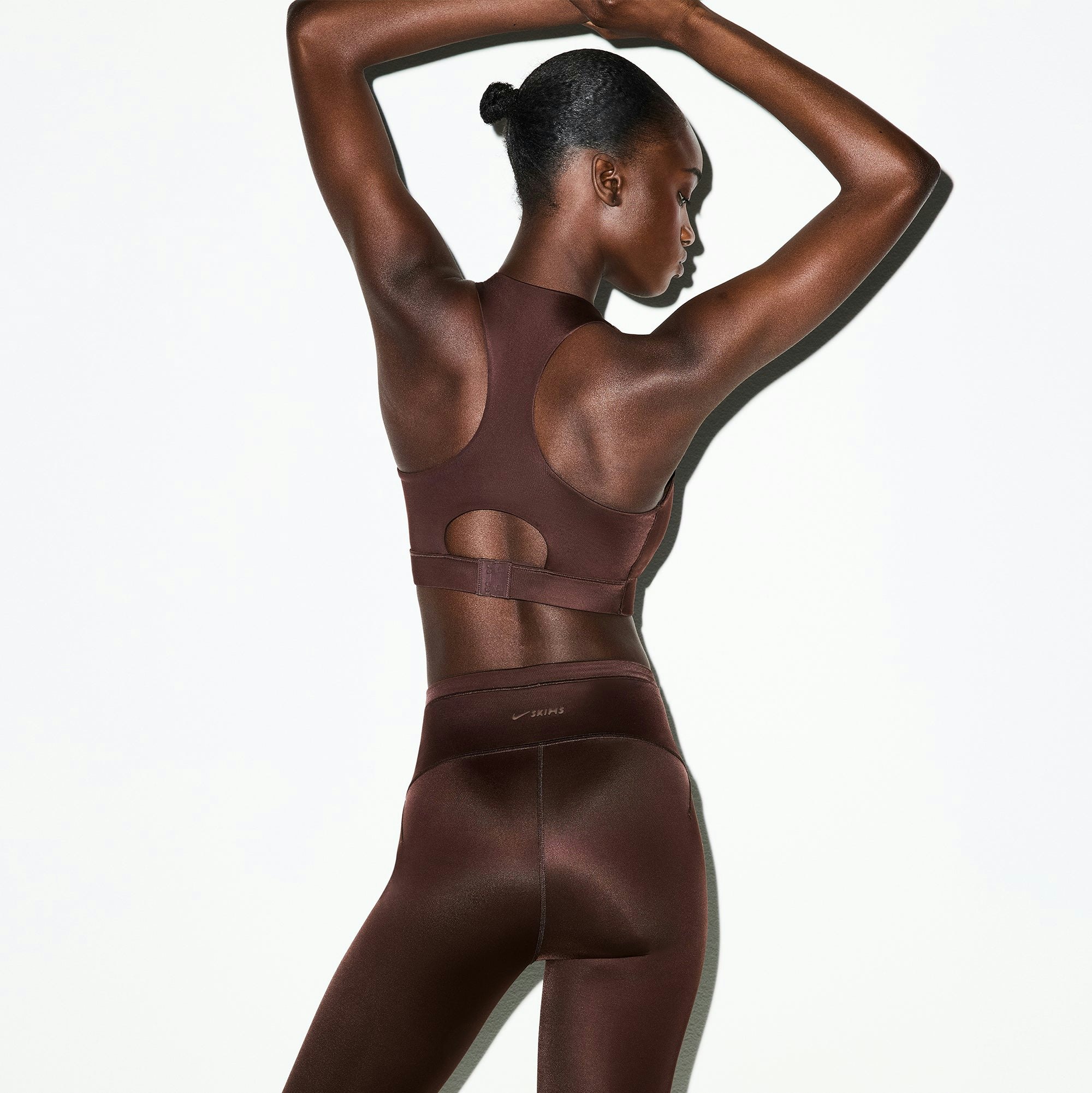 NikeSKIMS SHINE HIGH NECK BRA | PHOENIX ON A MODEL SIDE VIEW @ | FOCUS: 0.0, 1.0, 0.9