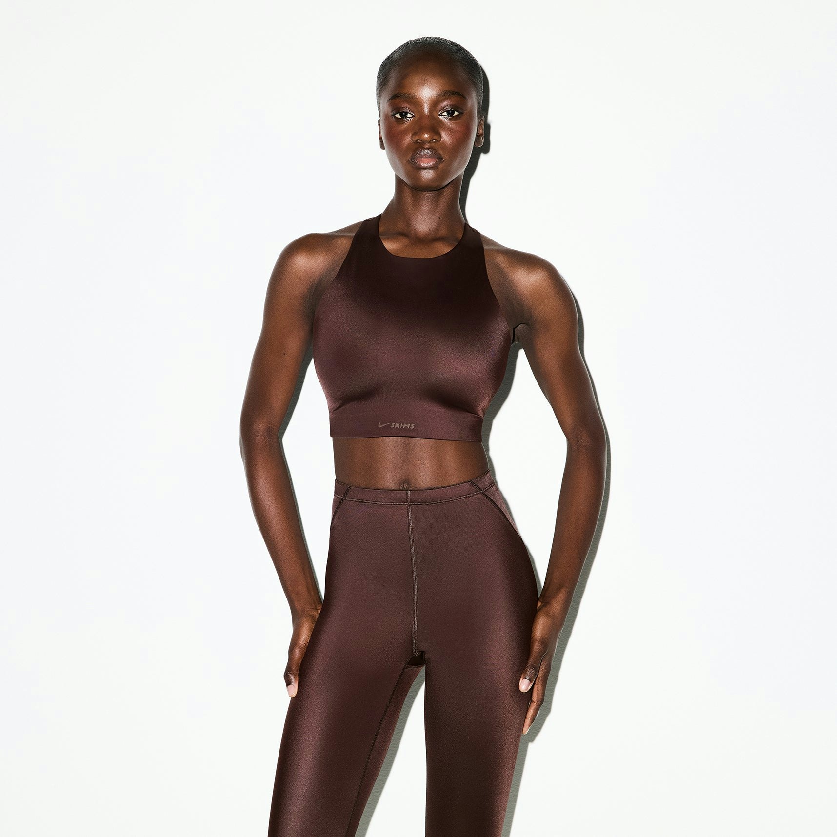 NikeSKIMS SHINE HIGH NECK BRA | PHOENIX ON A MODEL SIDE VIEW @ | FOCUS: 0.0, 1.0, 0.9