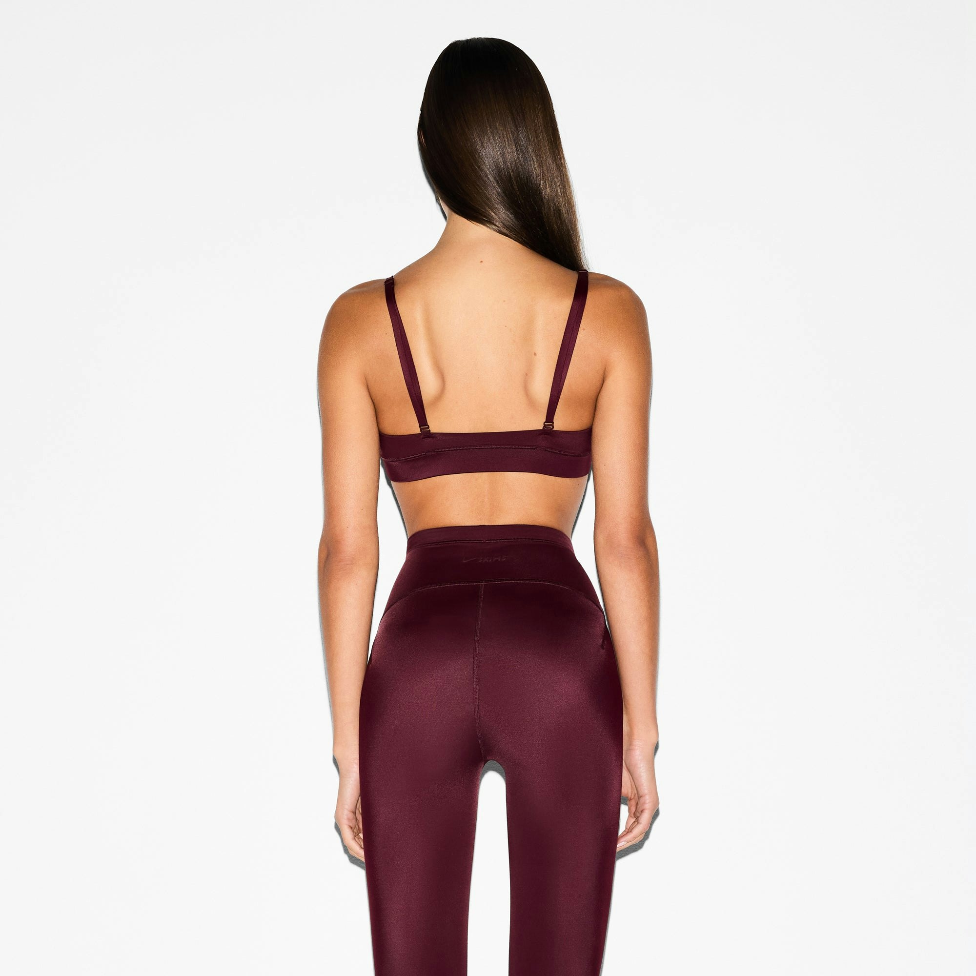 NikeSKIMS SHINE TRIANGLE BRA | CURRANT ON A MODEL SIDE VIEW @ | FOCUS: 0.0, 1.0, 0.9