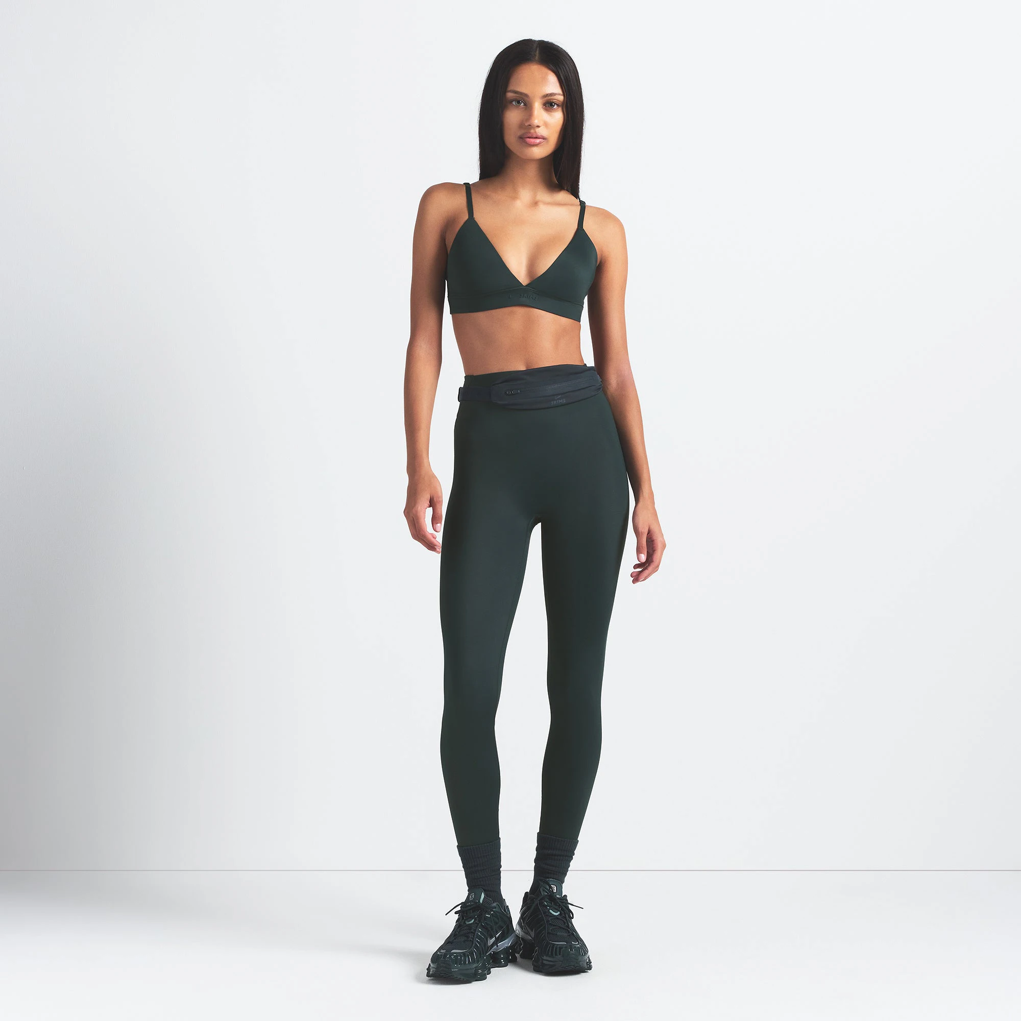 NikeSKIMS SHINE TRIANGLE BRA | DARK TEAL ON A MODEL FRONT VIEW @ | FOCUS: 0.0, 1.0, 0.9