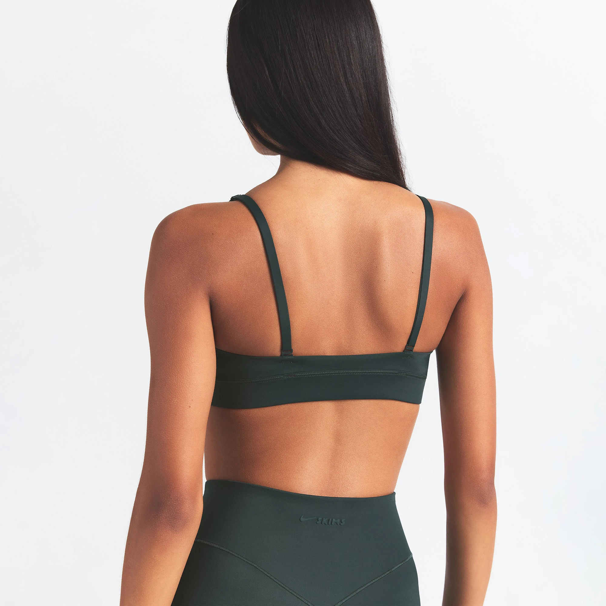 NikeSKIMS SHINE TRIANGLE BRA | DARK TEAL ON A MODEL SIDE VIEW @ | FOCUS: 0.0, 1.0, 0.9