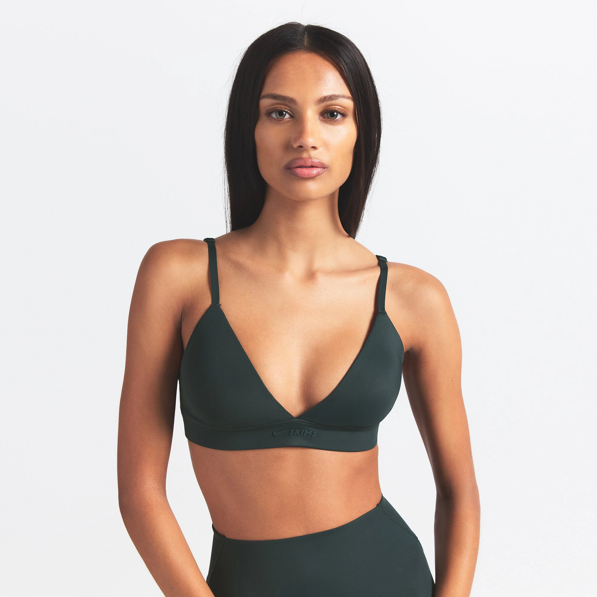 NikeSKIMS SHINE TRIANGLE BRA | DARK TEAL ON A MODEL SIDE VIEW @ | FOCUS: 0.0, 1.0, 0.9