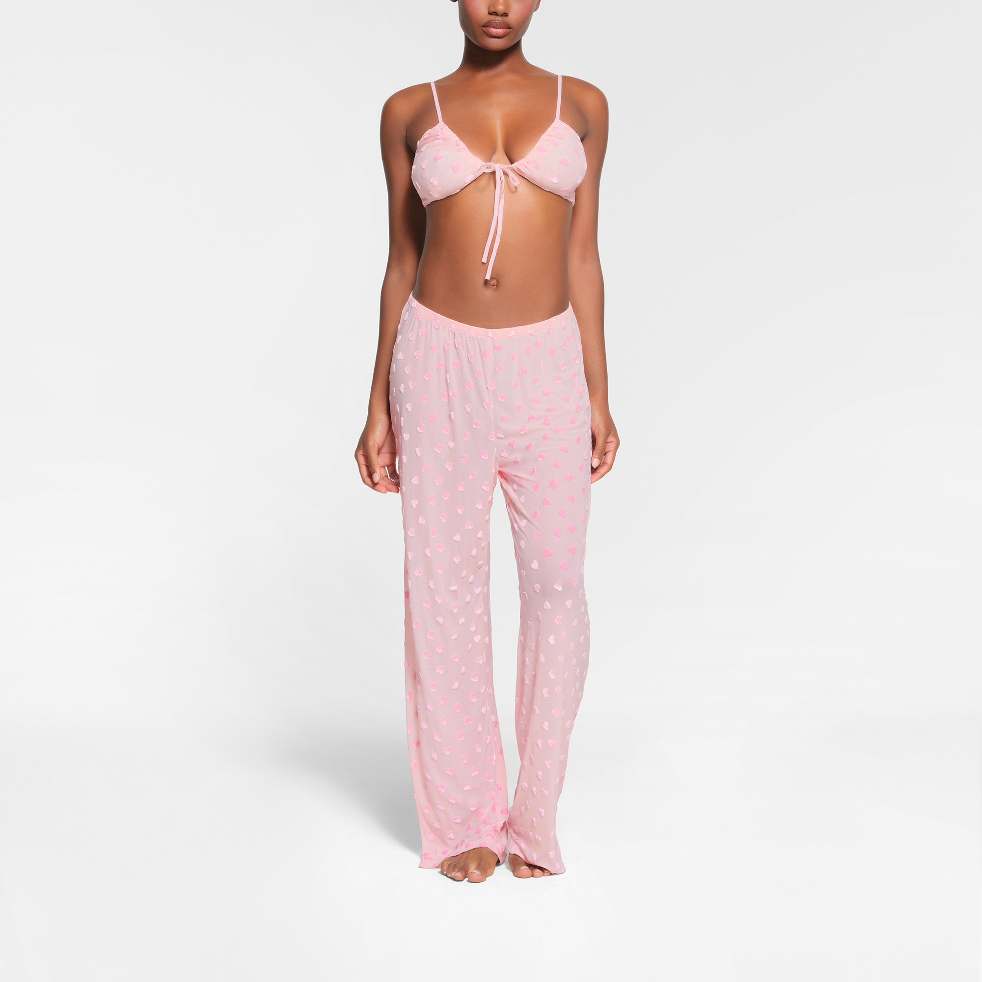 SHEER VELVET TIE FRONT BRALETTE | BABY PINK ON A MODEL FRONT VIEW | FOCUS 0, 0.3, 0.3,