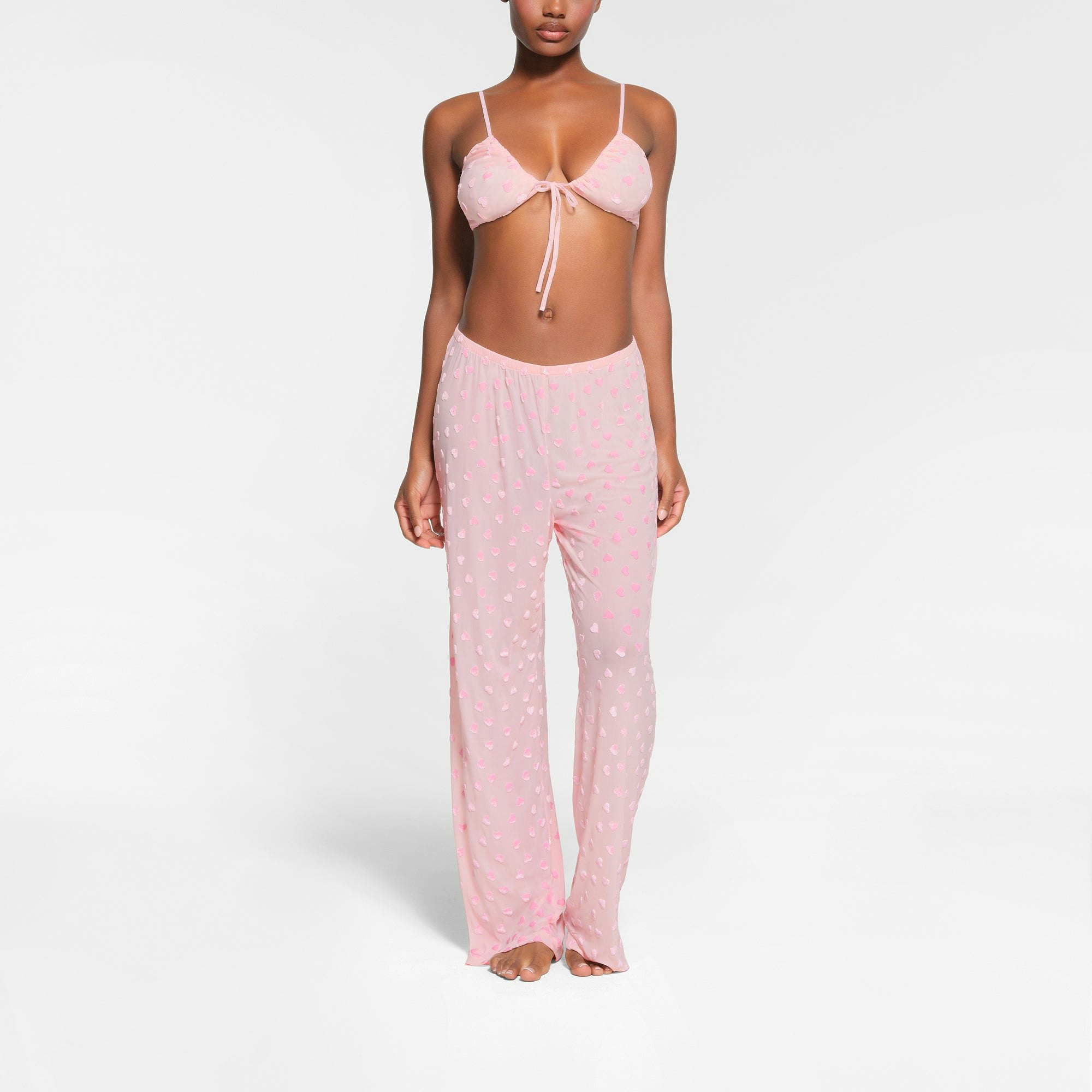 SHEER VELVET TIE FRONT BRALETTE | BABY PINK ON A MODEL FRONT VIEW | FOCUS 0, 0.3, 0.3,