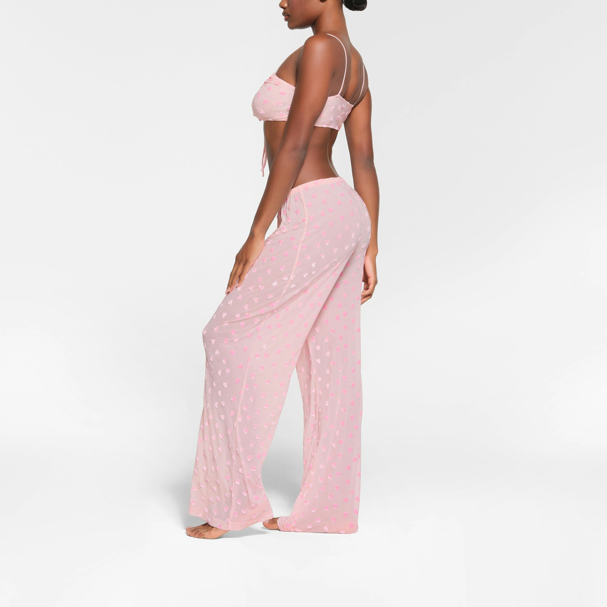 SHEER VELVET TIE FRONT BRALETTE | BABY PINK ON A MODEL SIDE VIEW