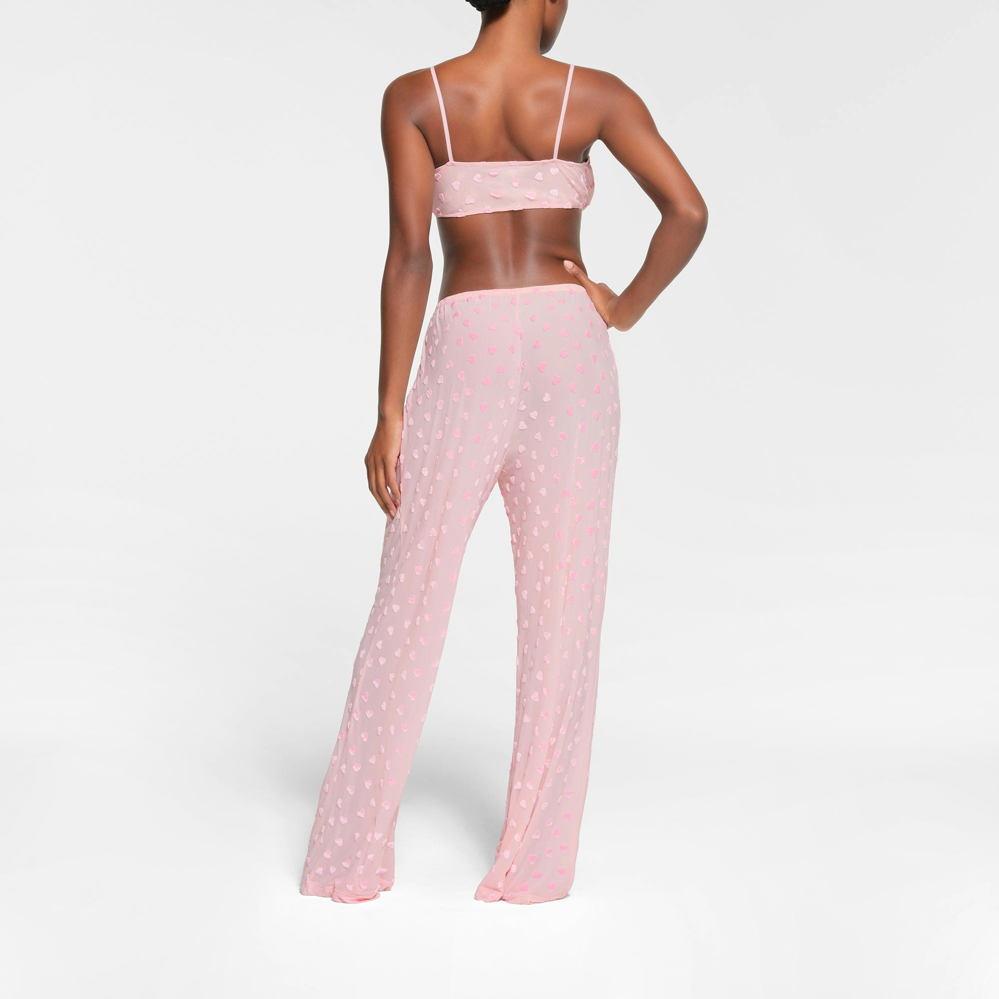 SHEER VELVET TIE FRONT BRALETTE | BABY PINK ON A MODEL BACK VIEW