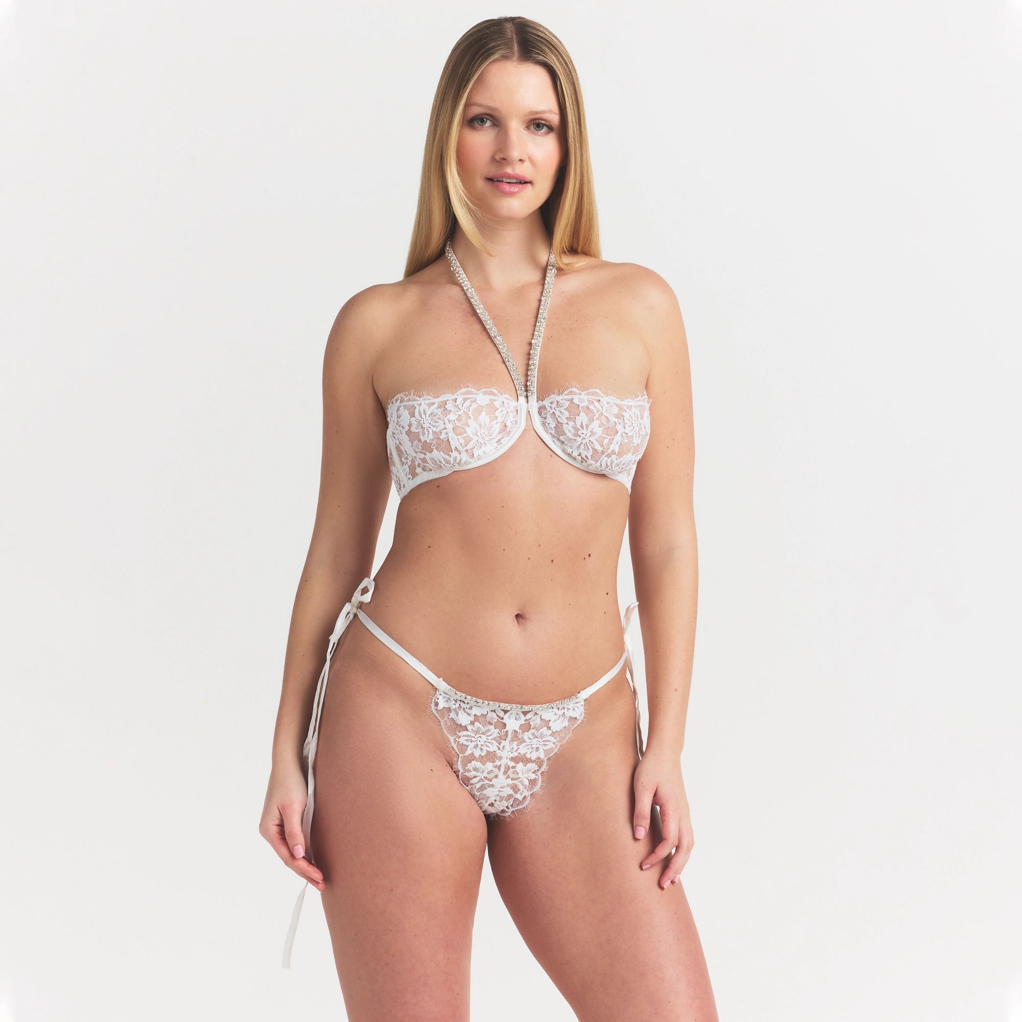 SKIMS LACE UNLINED HALTER BRA | SNOW ON A MODEL SIDE VIEW