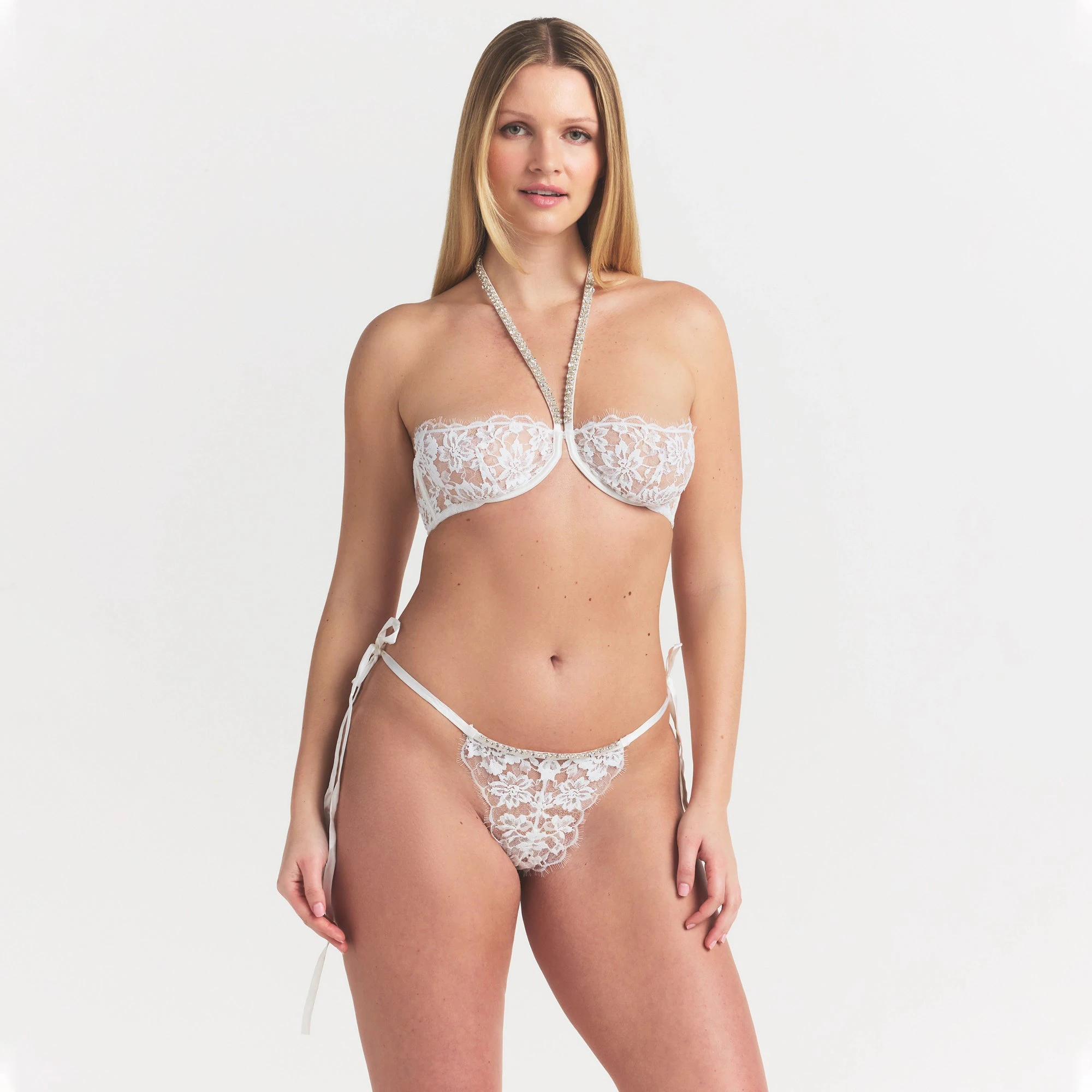 SKIMS LACE UNLINED HALTER BRA | SNOW ON A MODEL SIDE VIEW