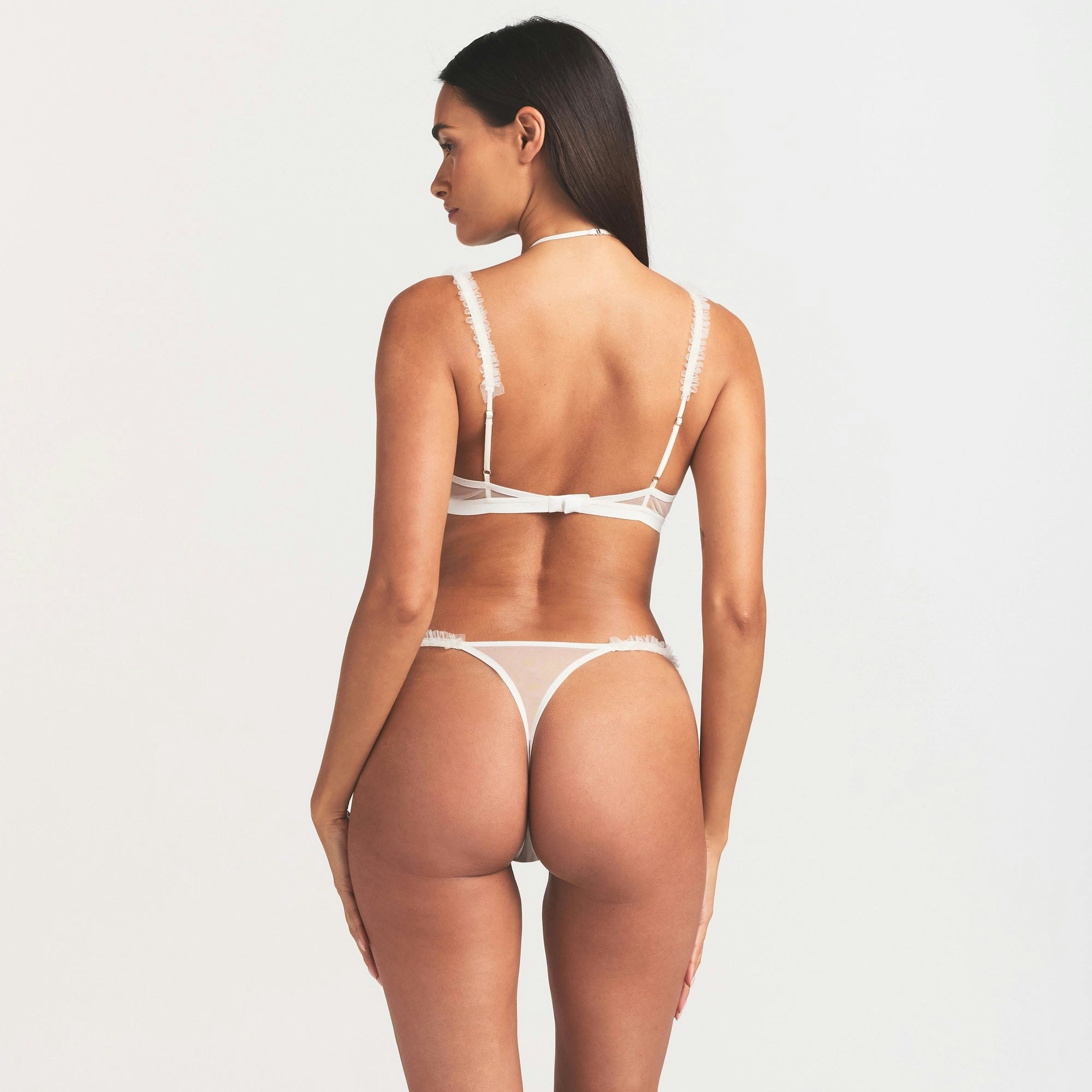 ULTRA FINE MESH RUFFLE BRA | IVORY ON A MODEL SIDE VIEW @ | FOCUS: 0.0, 1.0, 0.9