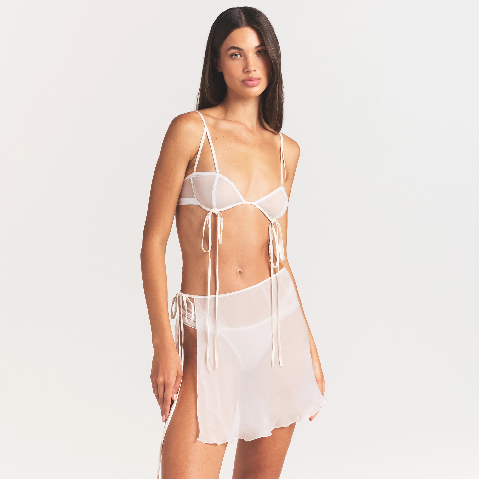 ULTRA FINE MESH BOW BRA | IVORY ON A MODEL SIDE VIEW @ | FOCUS: 0.0, 1.0, 0.9