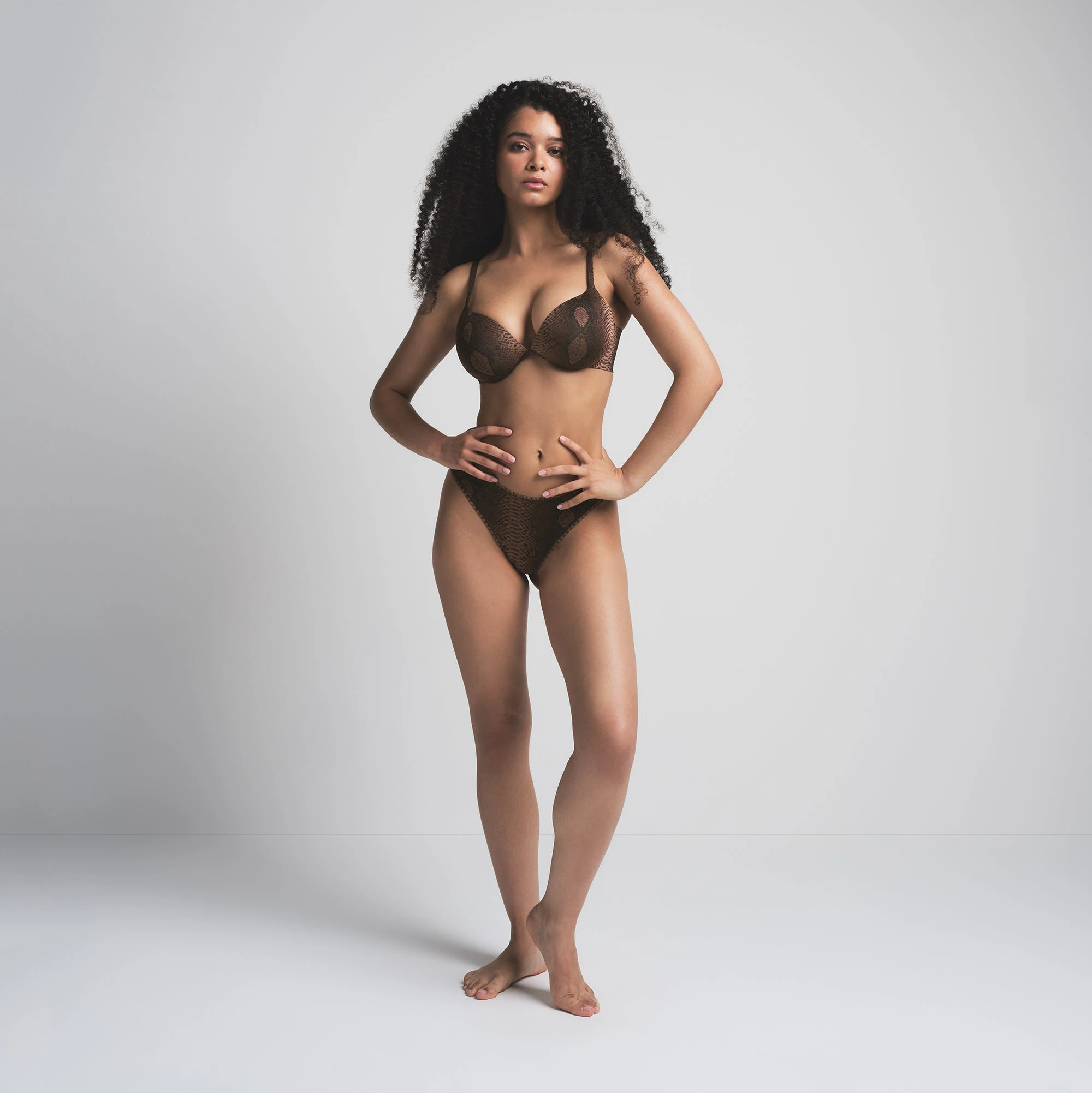 SKIMS ULTIMATE BRA TEARDROP PUSH-UP BRA | ESPRESSO SNAKESKIN PRINT ON A MODEL FRONT VIEW | FOCUS: 0.0, 1.0, 0.9