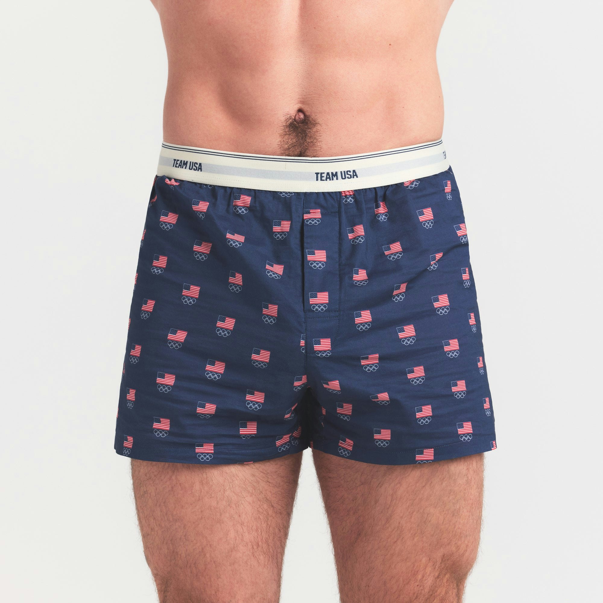 SKIMS FOR TEAM USA COTTON POPLIN MENS OLYMPIC BOXER | NAVY ON A MODEL SIDE VIEW @ | FOCUS: 0.0, 1.0, 0.9