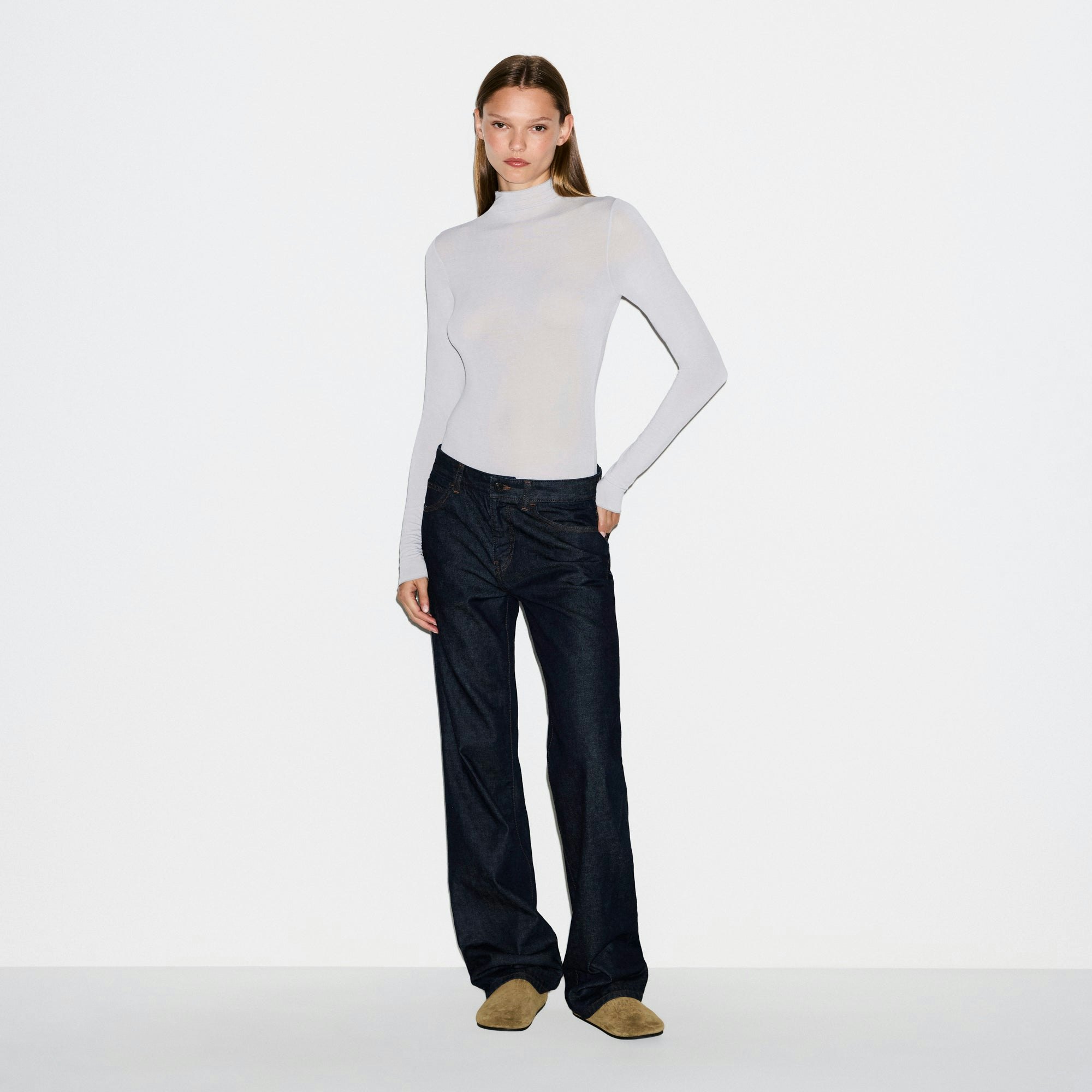 SHEER MODAL LONG SLEEVE TURTLENECK BODYSUIT | MIST ON A MODEL FRONT VIEW @ | FOCUS: 0.0, 1.0, 0.9