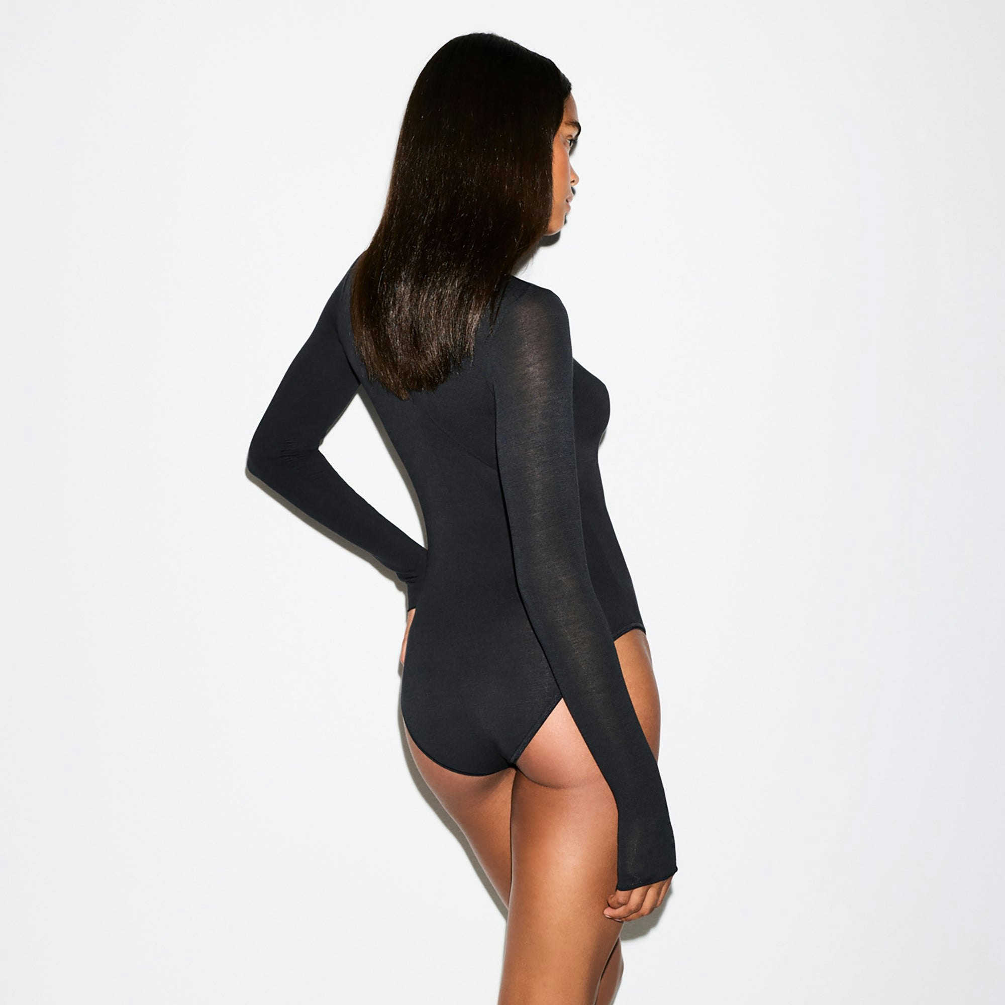 SHEER MODAL LONG SLEEVE TURTLENECK BODYSUIT | ONYX ON A MODEL FRONT VIEW @ | FOCUS: 0.0, 1.0, 0.9