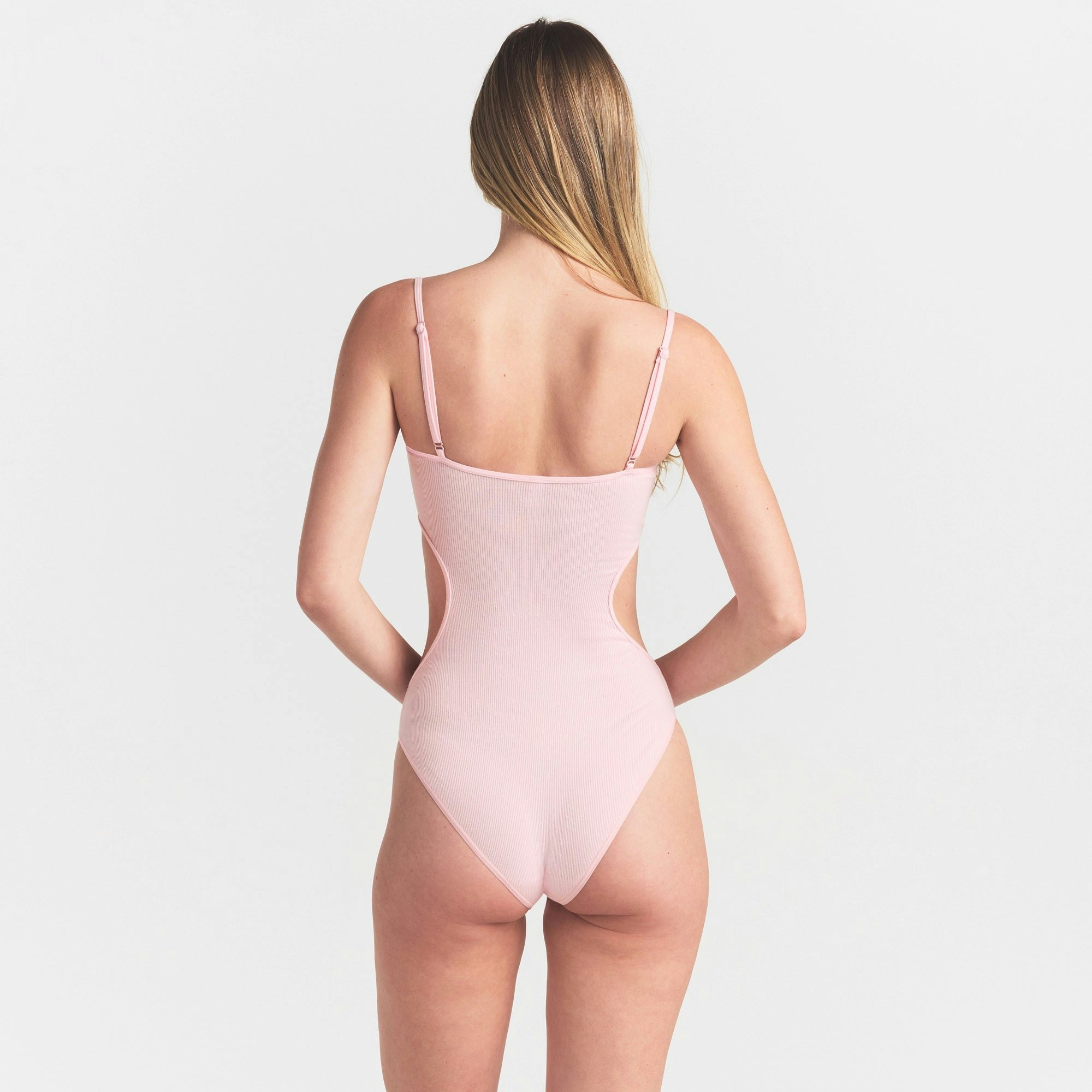 COTTON RIB CUT OUT BODYSUIT | CHERRY BLOSSOM ON A MODEL SIDE VIEW @ | FOCUS: 0.0, 1.0, 0.9