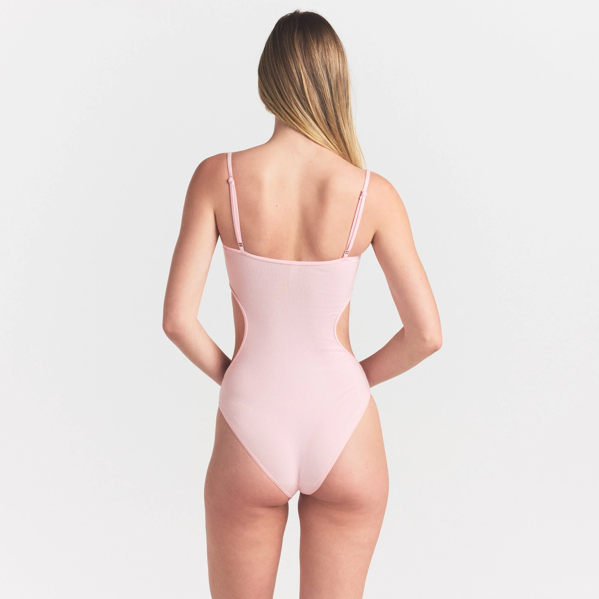 COTTON RIB CUT OUT BODYSUIT | CHERRY BLOSSOM ON A MODEL SIDE VIEW @ | FOCUS: 0.0, 1.0, 0.9