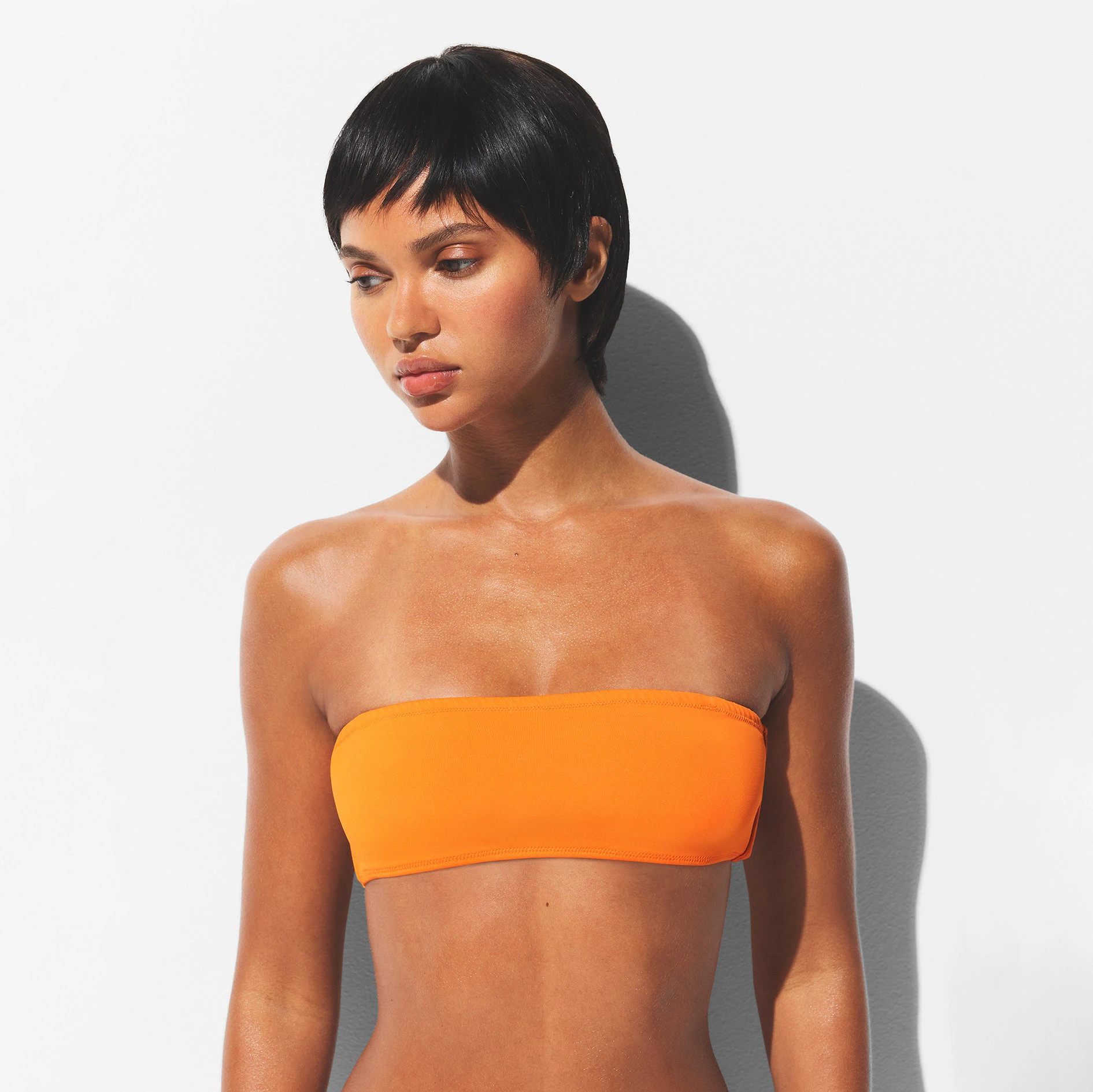 SIGNATURE SWIM MICRO BANDEAU TOP | TANGERINE ON A MODEL FRONT VIEW | FOCUS: 0.0, 1.0, 0.9