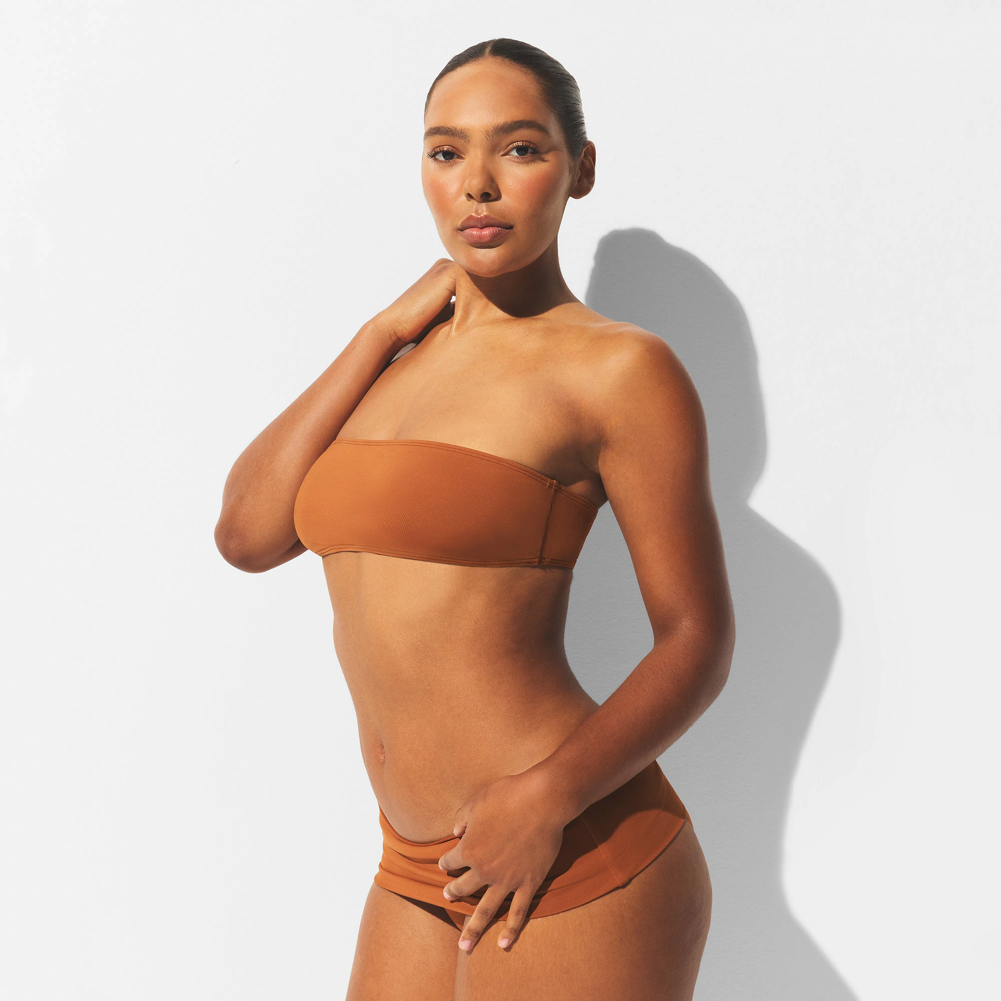 MINIMAL SWIM BANDEAU BIKINI TOP | BRONZE ON A MODEL SIDE VIEW | FOCUS: 0.0, 1.0, 0.9