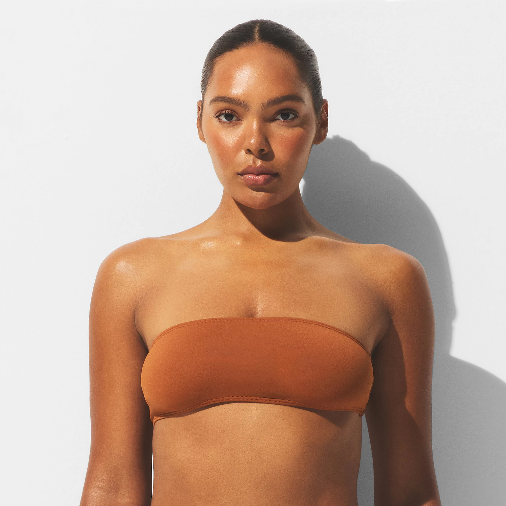 MINIMAL SWIM BANDEAU BIKINI TOP | BRONZE ON A MODEL FRONT VIEW | FOCUS: 0.0, 1.0, 0.9