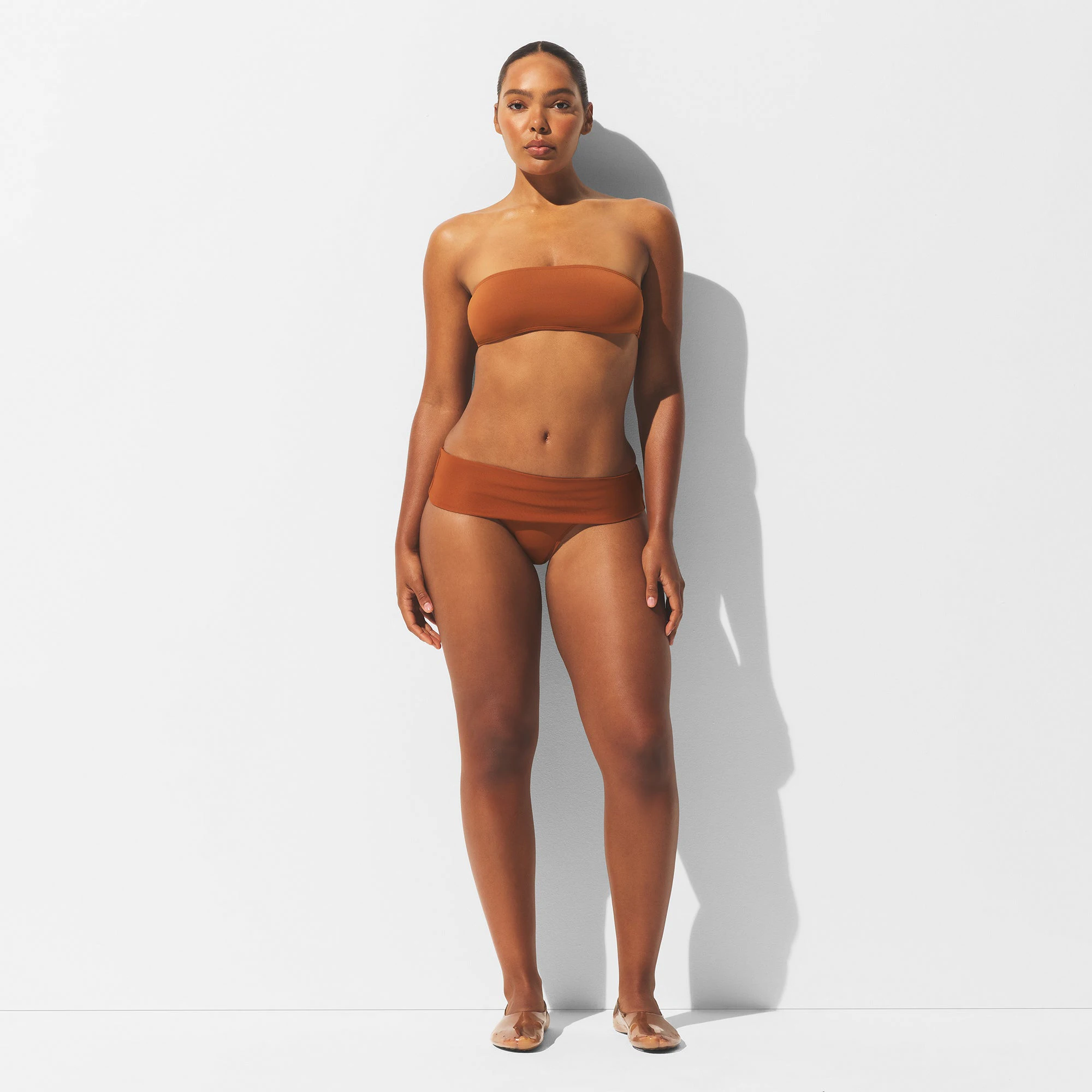 MINIMAL SWIM BANDEAU BIKINI TOP | BRONZE ON A MODEL FRONT VIEW | FOCUS: 0.0, 1.0, 0.9