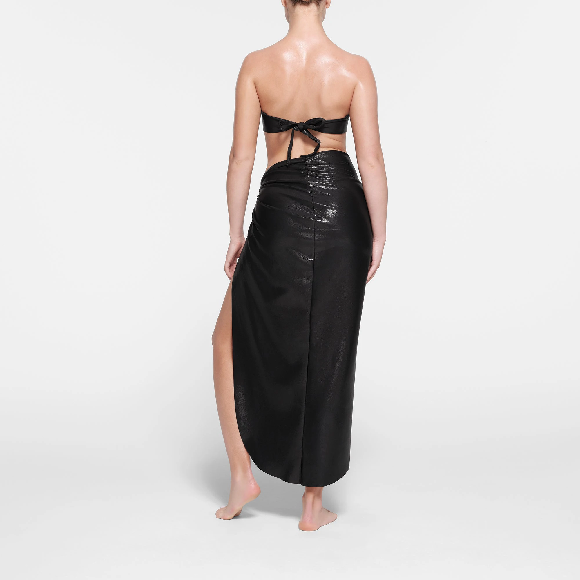 LIQUID SHINE SWIM KNOTTED BANDEAU BIKINI TOP | ONYX ON A MODEL BACK VIEW