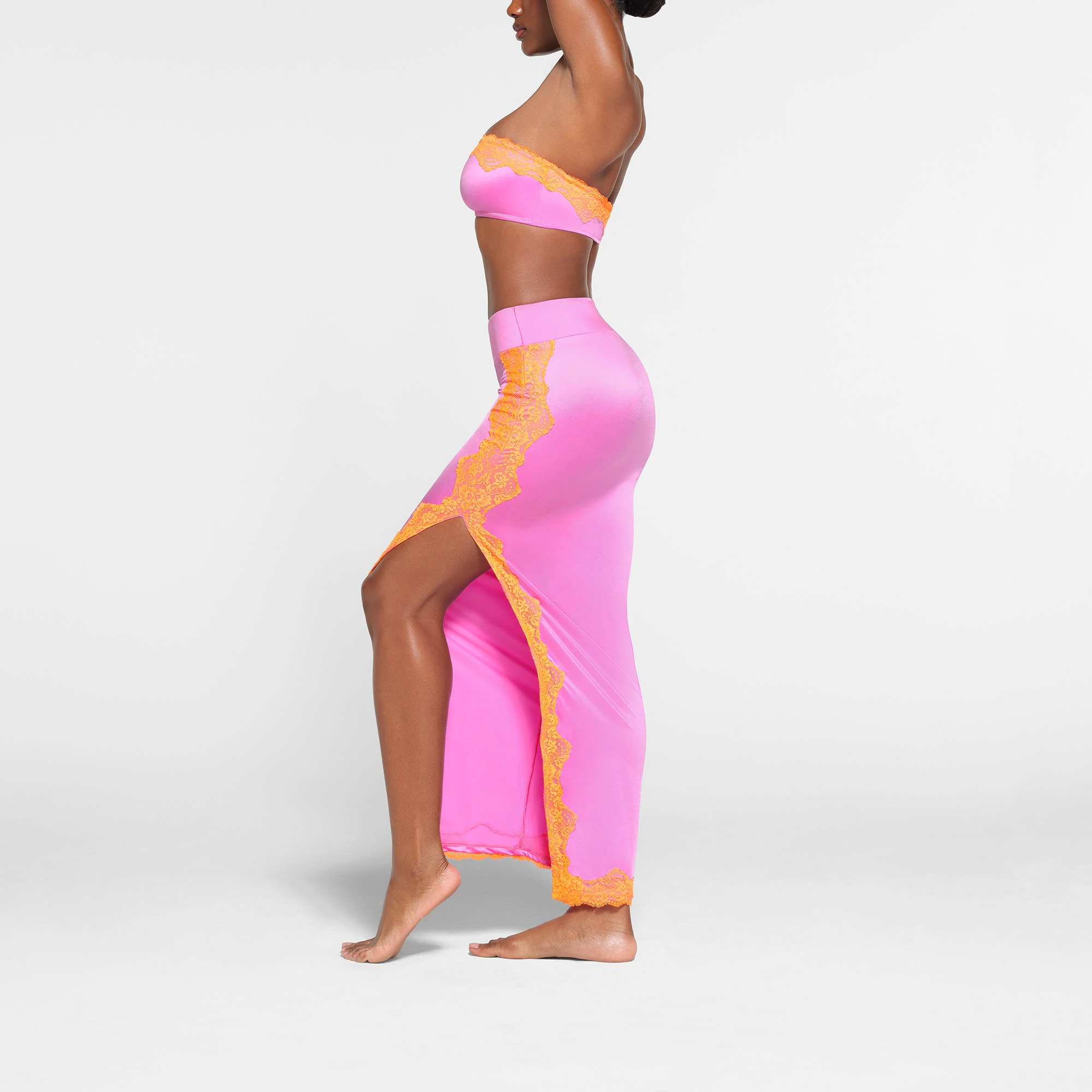 LACE SWIM BANDEAU BIKINI TOP | NEON ORCHID ON A MODEL SIDE VIEW