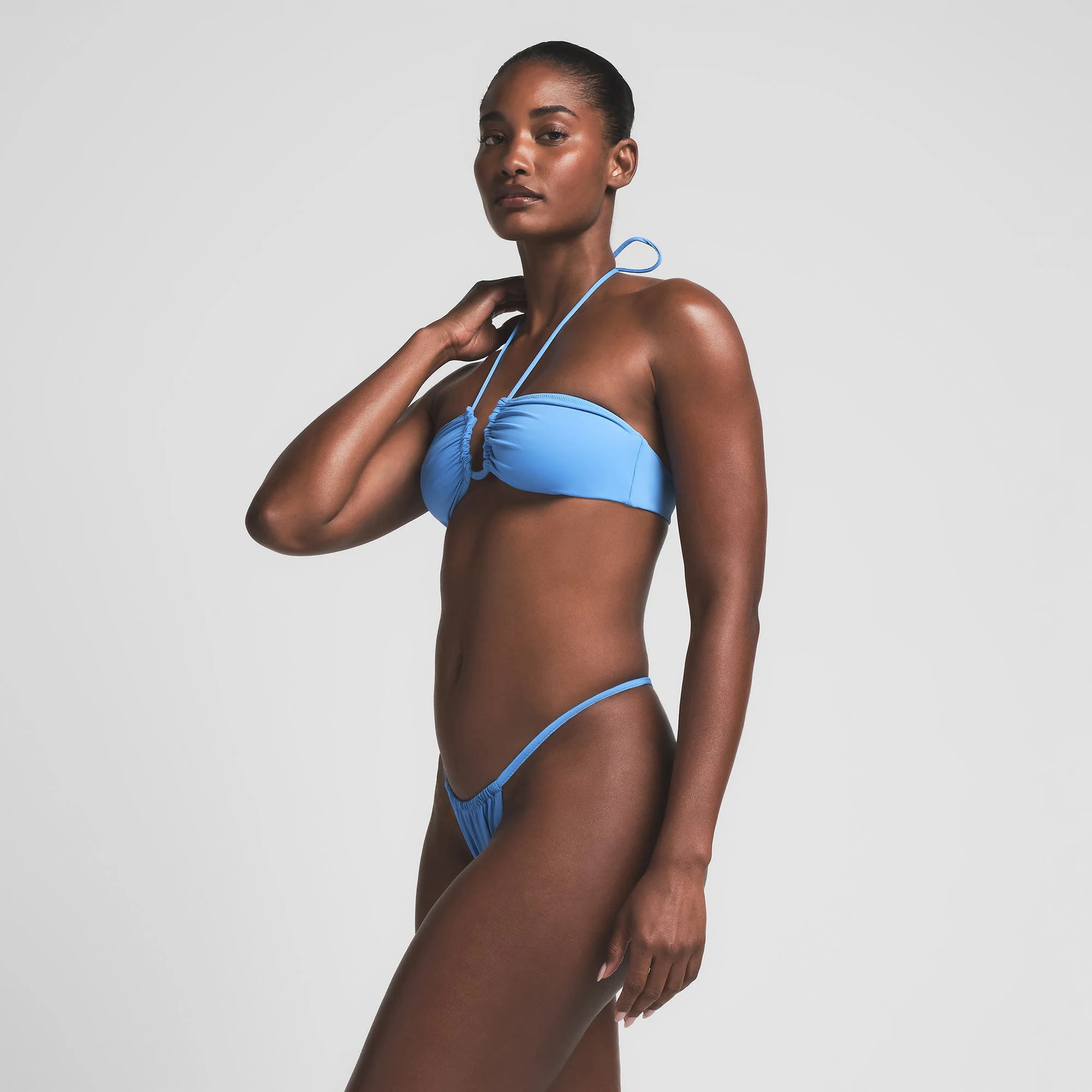 SIGNATURE SWIM HALTER BIKINI TOP | TIDE ON A MODEL SIDE VIEW | FOCUS: 0.0, 1.0, 0.9