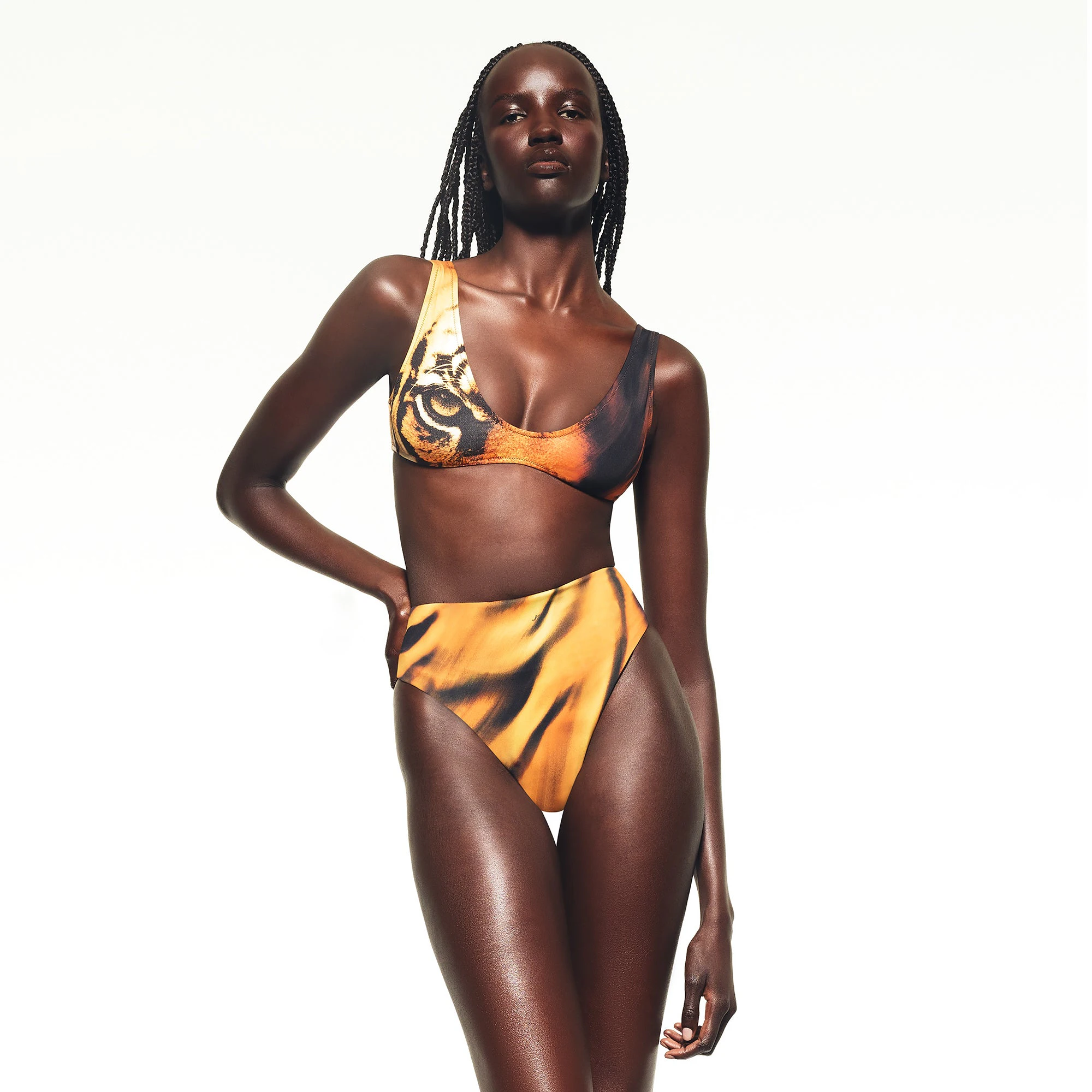 ROBERTO CAVALLI X SKIMS PLUNGE BIKINI TOP | TIGER FACE PRINT ON A MODEL FRONT VIEW | FOCUS: 0.0, 1.0, 0.9