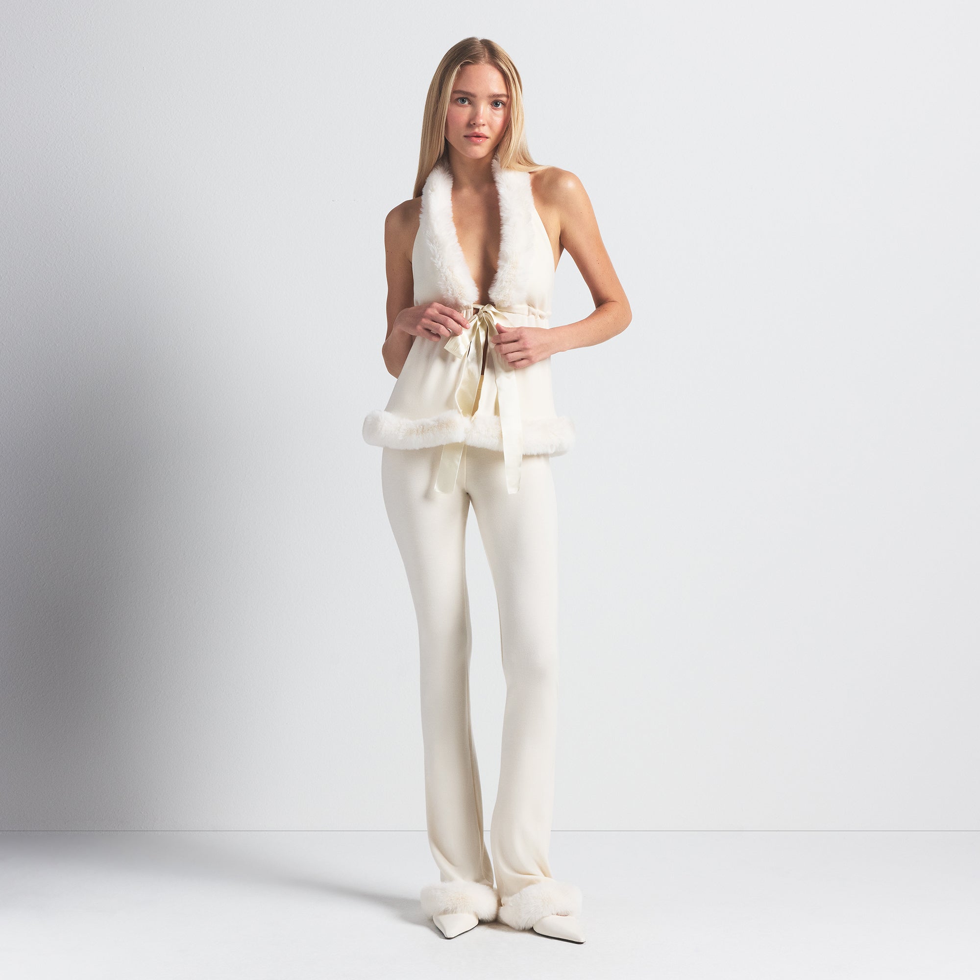 SKIMS CLOUD SLIM FLARE PANT | ECRU ON A MODEL FRONT VIEW @ | FOCUS: 0.0, 1.0, 0.9