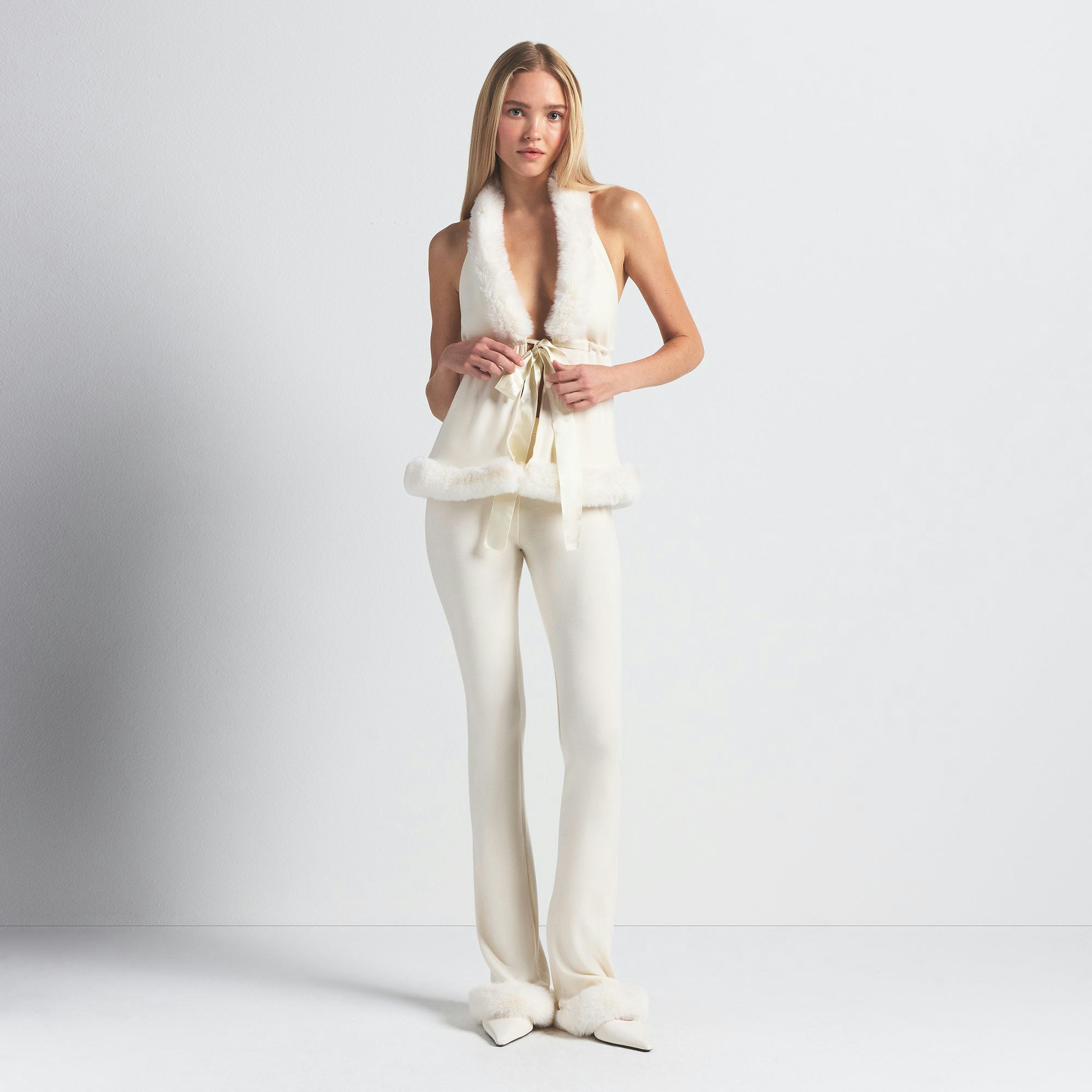 SKIMS CLOUD SLIM FLARE PANT | ECRU ON A MODEL FRONT VIEW @ | FOCUS: 0.0, 1.0, 0.9