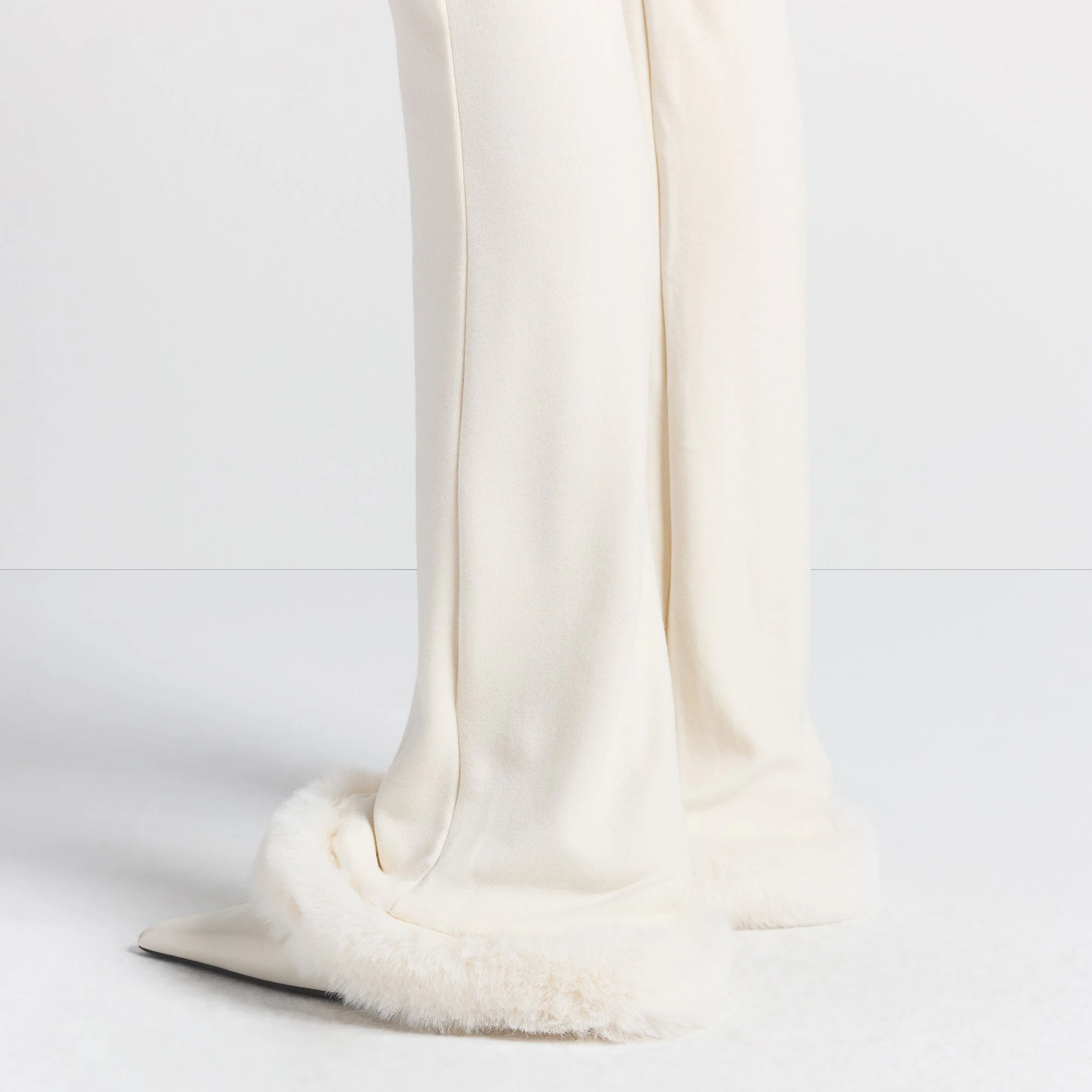 SKIMS CLOUD SLIM FLARE PANT | ECRU ON A MODEL SIDE VIEW @ | FOCUS: 0.0, 1.0, 0.9
