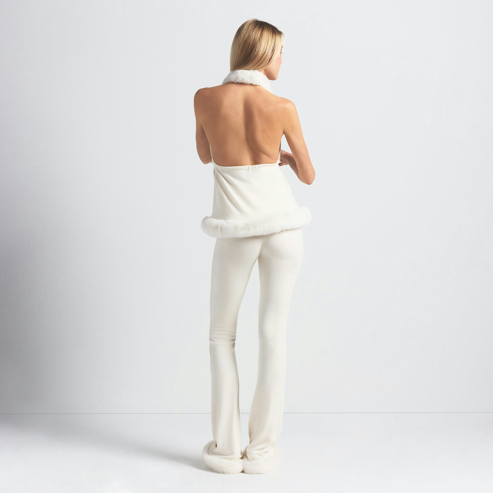 SKIMS CLOUD SLIM FLARE PANT | ECRU ON A MODEL BACK VIEW @ | FOCUS: 0.0, 1.0, 0.9