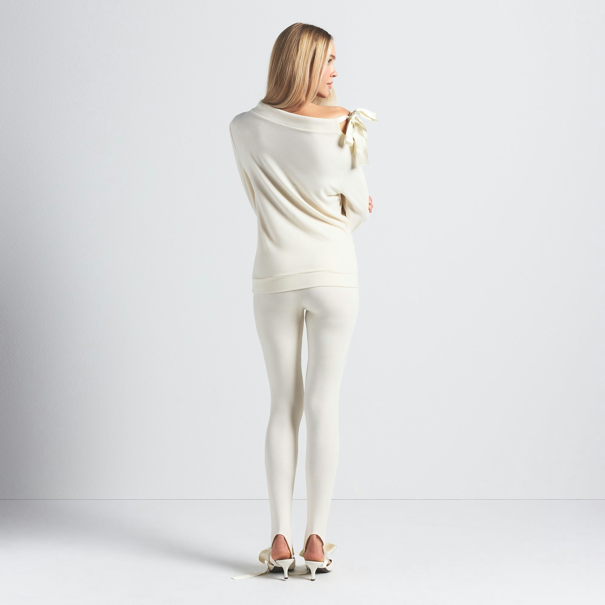 SKIMS CLOUD STIRRUP LEGGING | ECRU ON A MODEL BACK VIEW @ | FOCUS: 0.0, 1.0, 0.9
