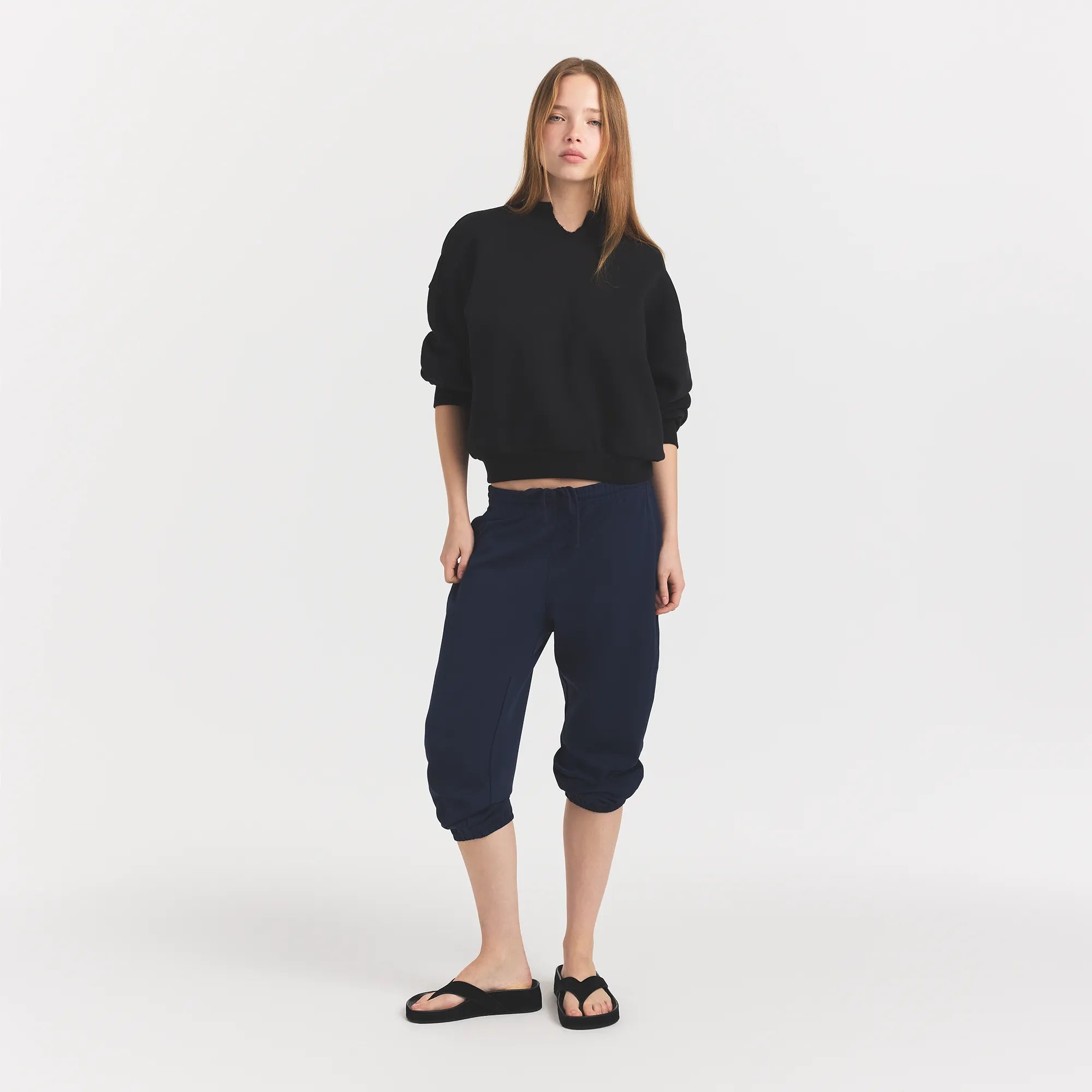 HEAVYWEIGHT CREPE CROPPED JOGGER | NAVY ON A MODEL FRONT VIEW @ | FOCUS: 0.0, 1.0, 0.9
