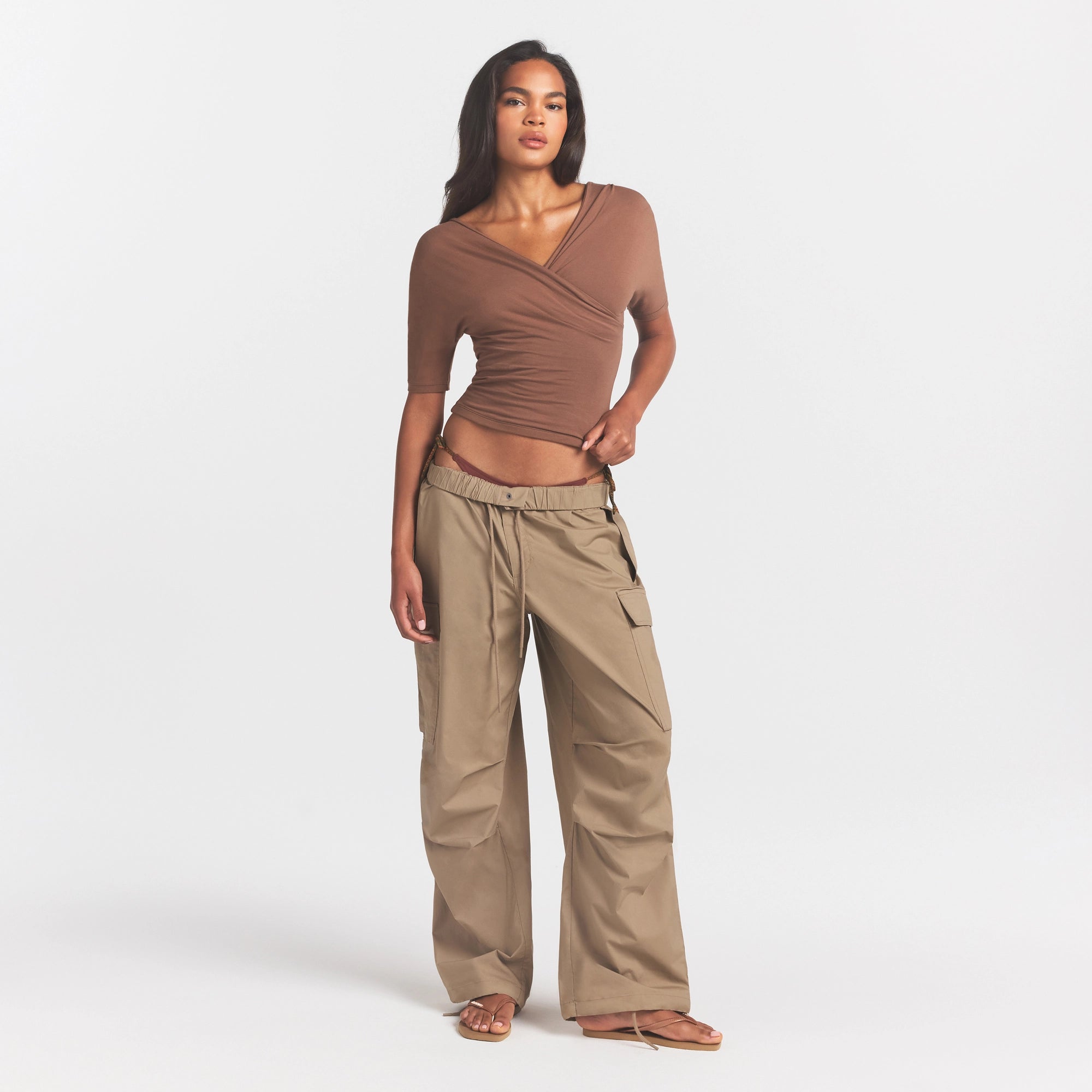 WOVEN COTTON OVERSIZED LOW RISE CARGO PANT | DESERT ON A MODEL FRONT VIEW @ | FOCUS: 0.0, 1.0, 0.9