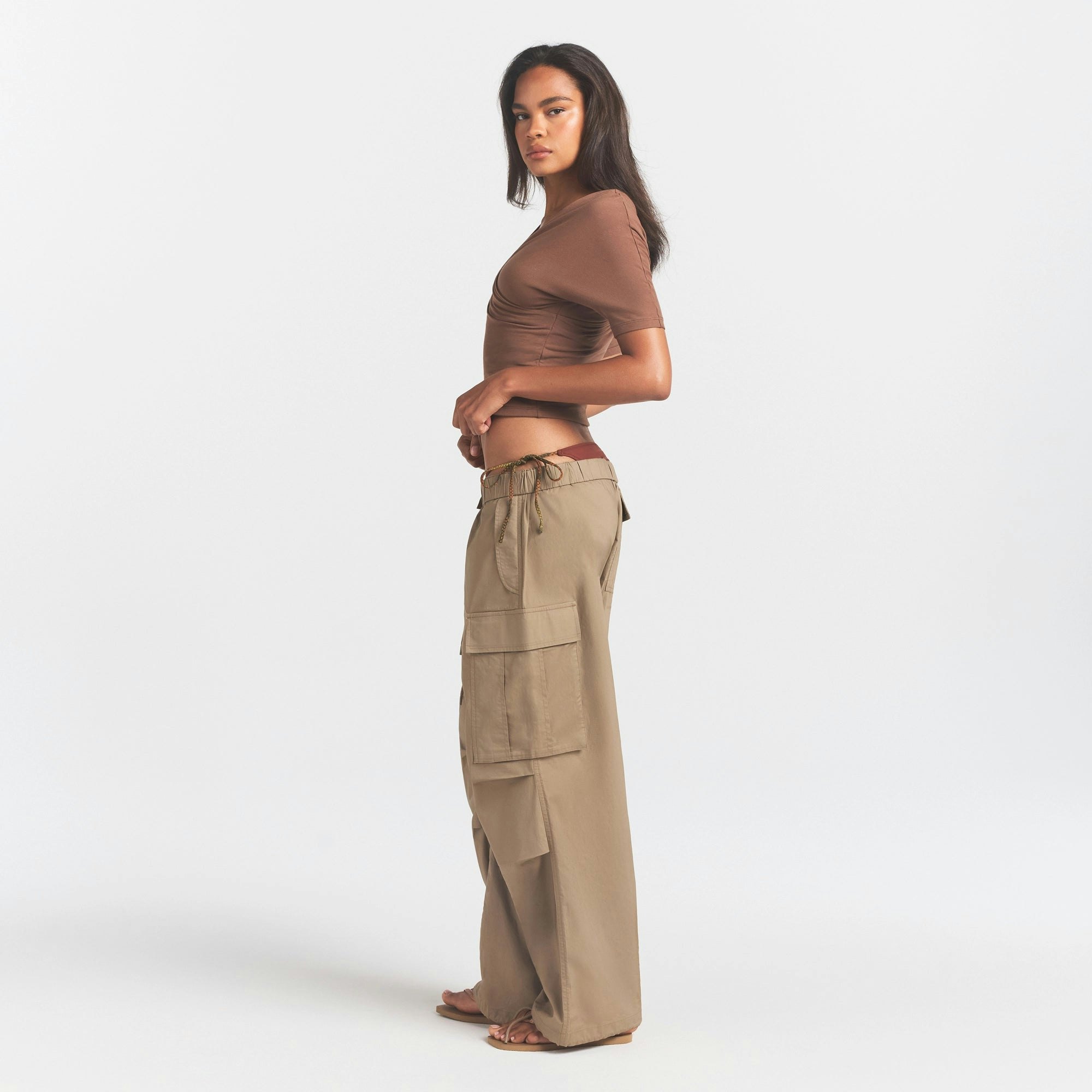WOVEN COTTON OVERSIZED LOW RISE CARGO PANT | DESERT ON A MODEL FRONT VIEW @ | FOCUS: 0.0, 1.0, 0.9