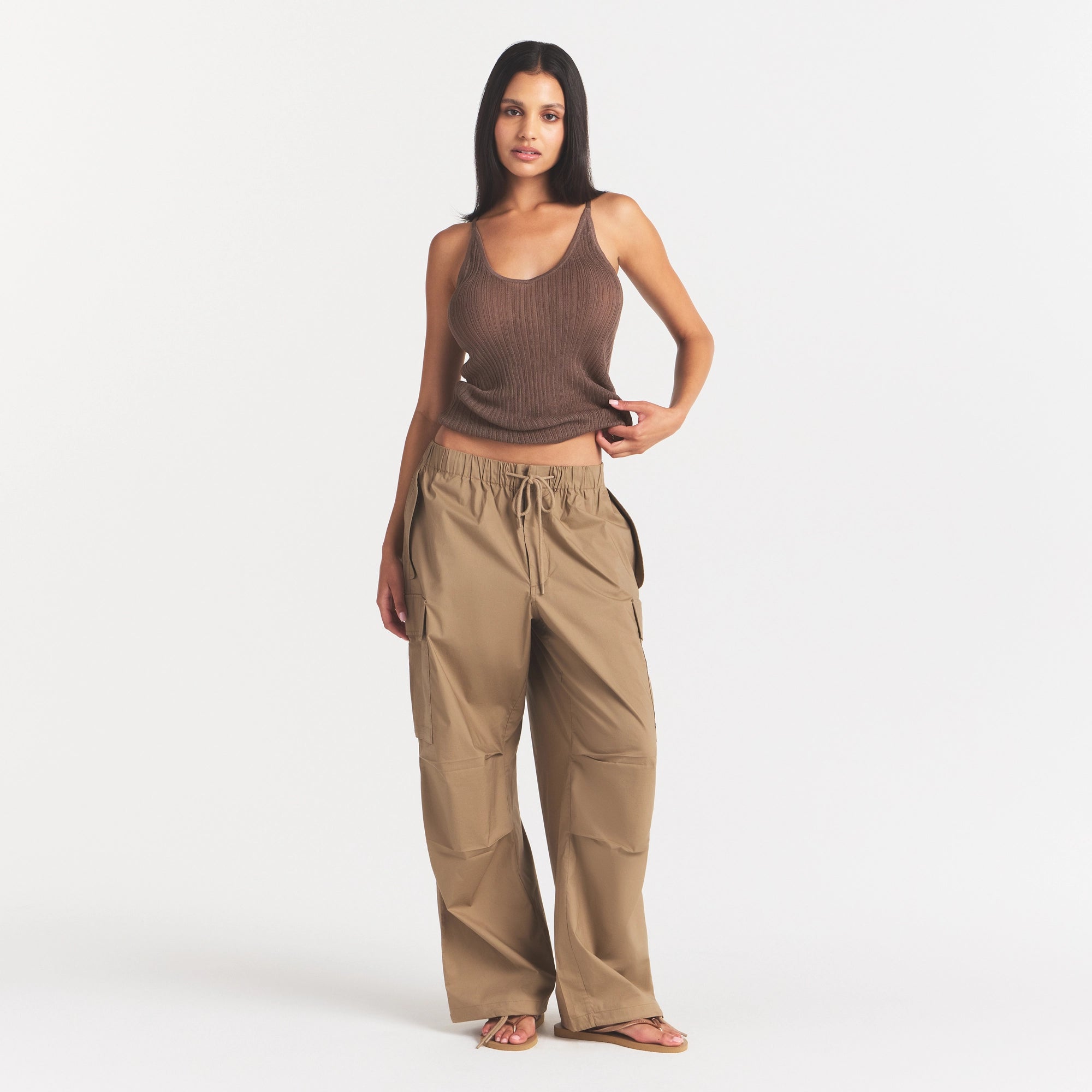 WOVEN COTTON OVERSIZED LOW RISE CARGO PANT | DESERT ON A MODEL FRONT VIEW