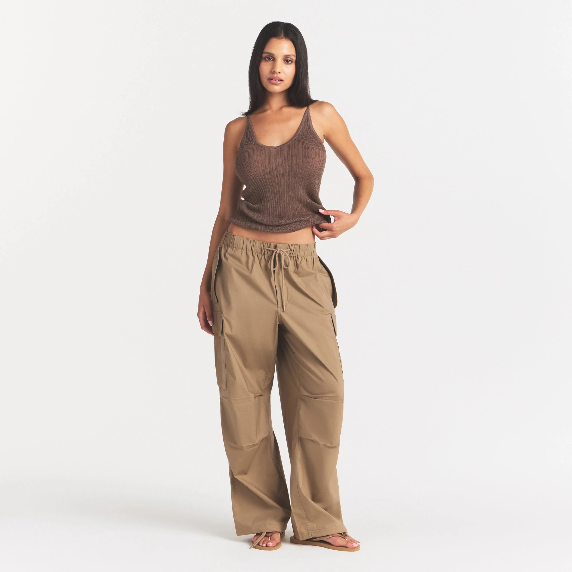 WOVEN COTTON OVERSIZED LOW RISE CARGO PANT | DESERT ON A MODEL FRONT VIEW @ | FOCUS: 0.0, 1.0, 0.9