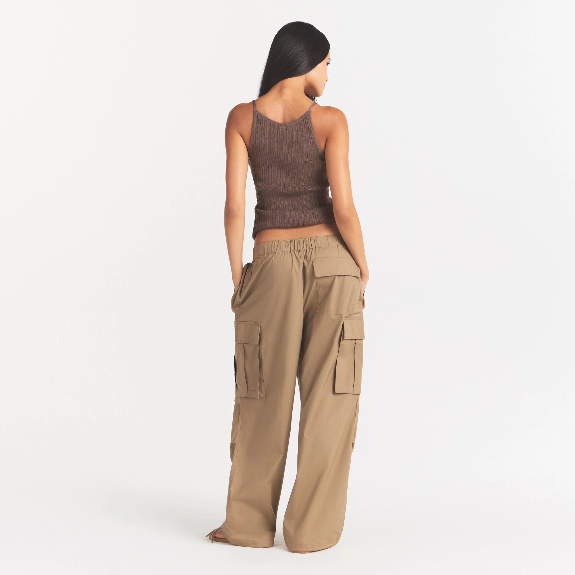 WOVEN COTTON OVERSIZED LOW RISE CARGO PANT | DESERT ON A MODEL FRONT VIEW @ | FOCUS: 0.0, 1.0, 0.9