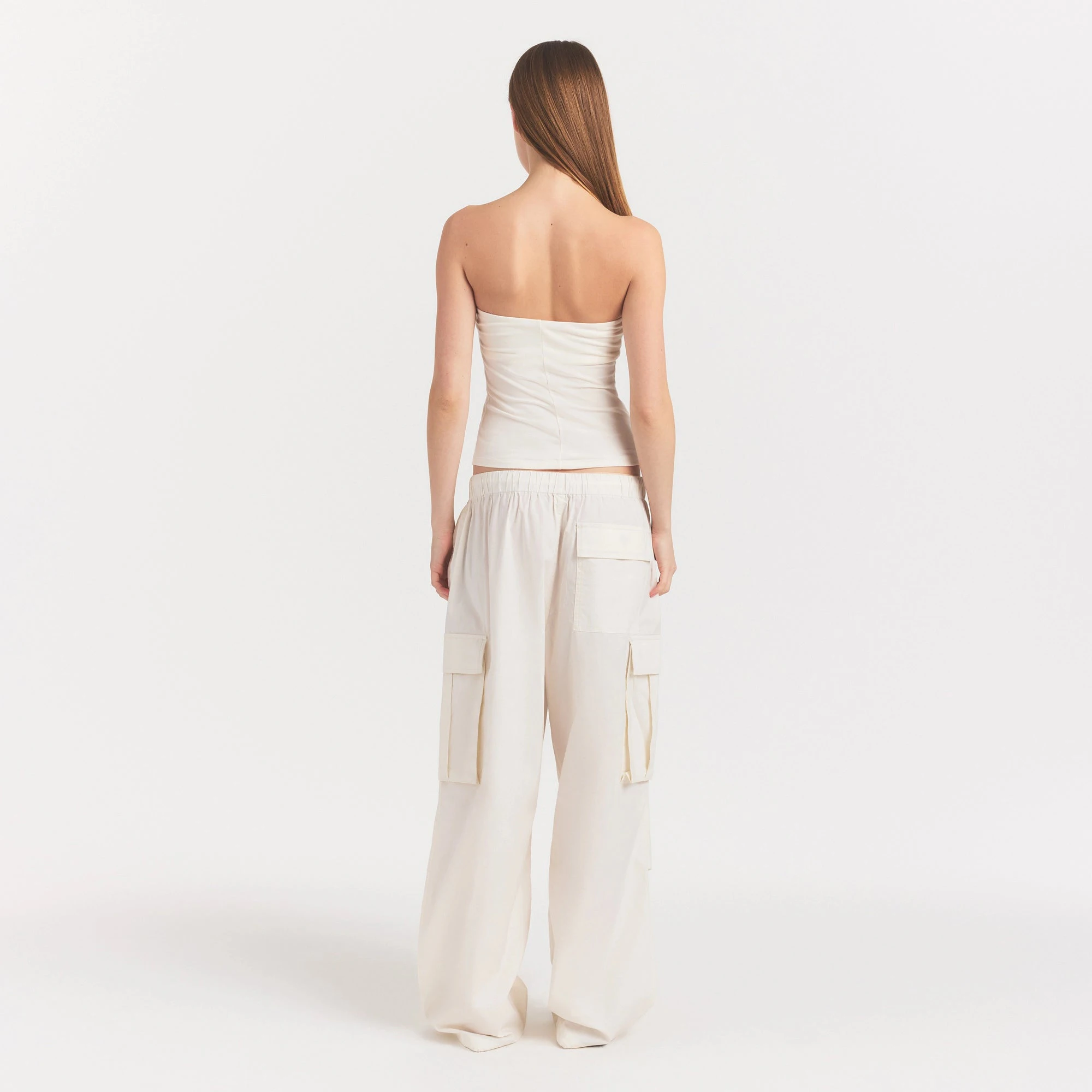 WOVEN COTTON OVERSIZED LOW RISE CARGO PANT | EGRET ON A MODEL FRONT VIEW @ | FOCUS: 0.0, 1.0, 0.9
