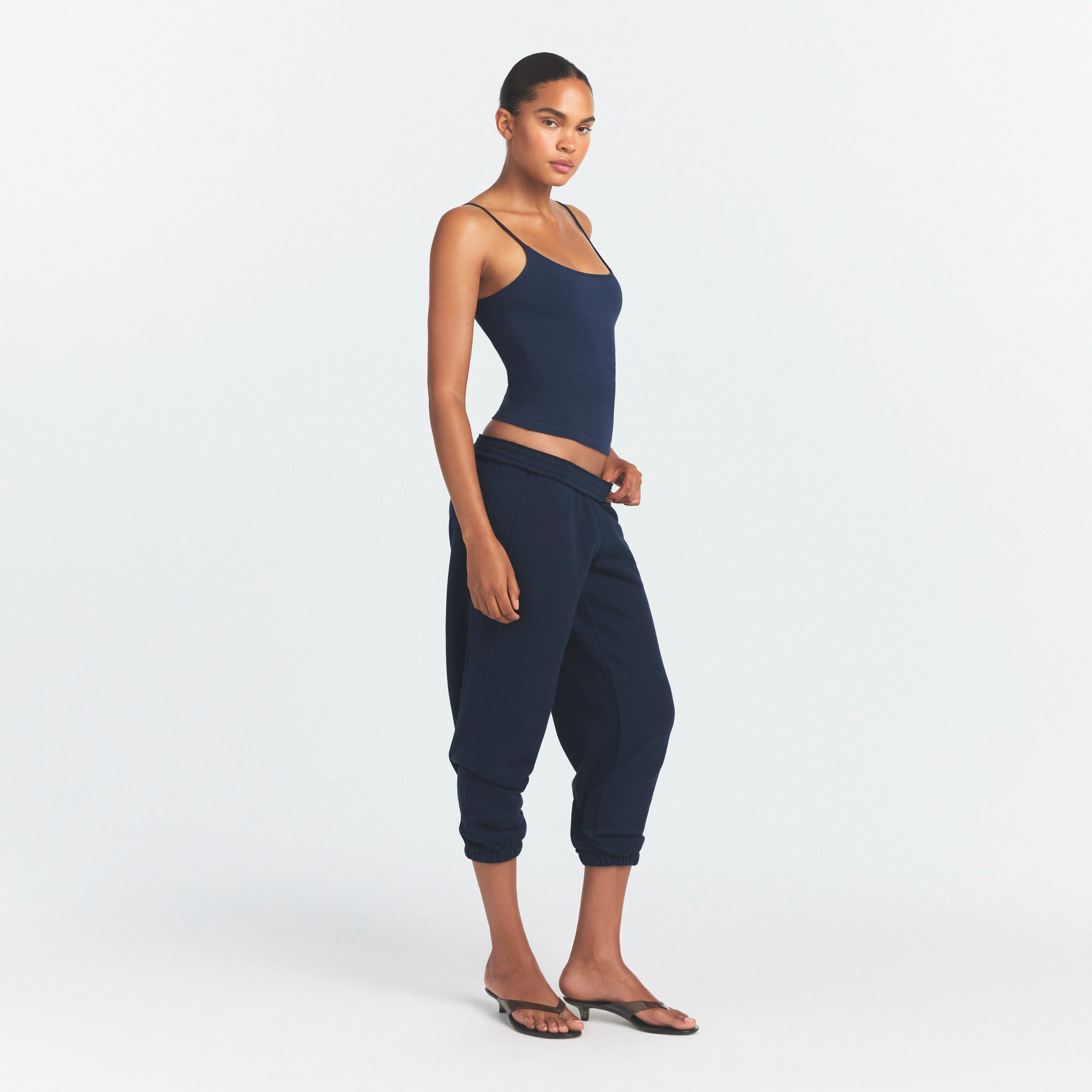 DRAPEY FRENCH TERRY CROPPED JOGGER | NAVY ON A MODEL SIDE VIEW @ | FOCUS: 0.0, 1.0, 0.9