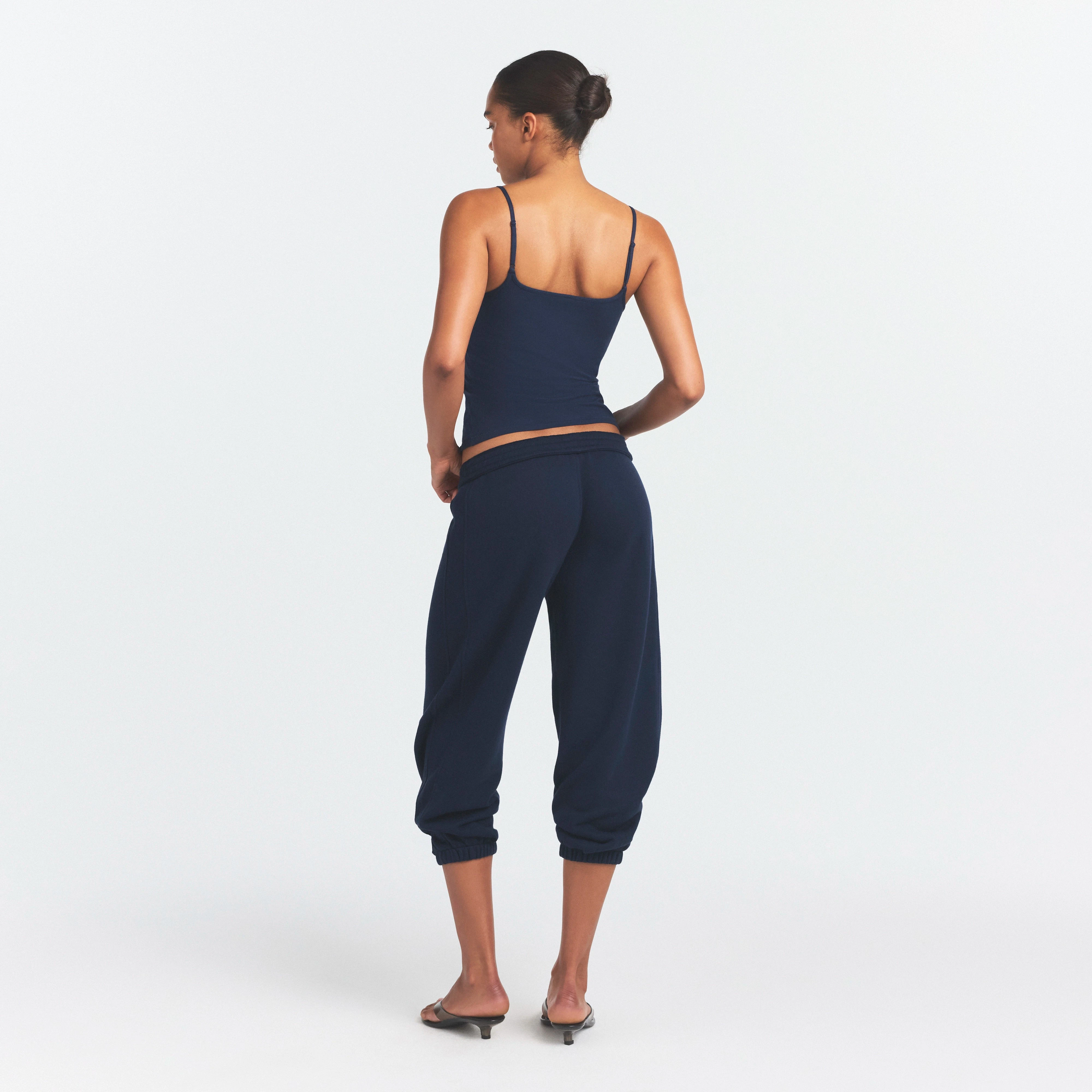 DRAPEY FRENCH TERRY CROPPED JOGGER | NAVY ON A MODEL SIDE VIEW @ | FOCUS: 0.0, 1.0, 0.9