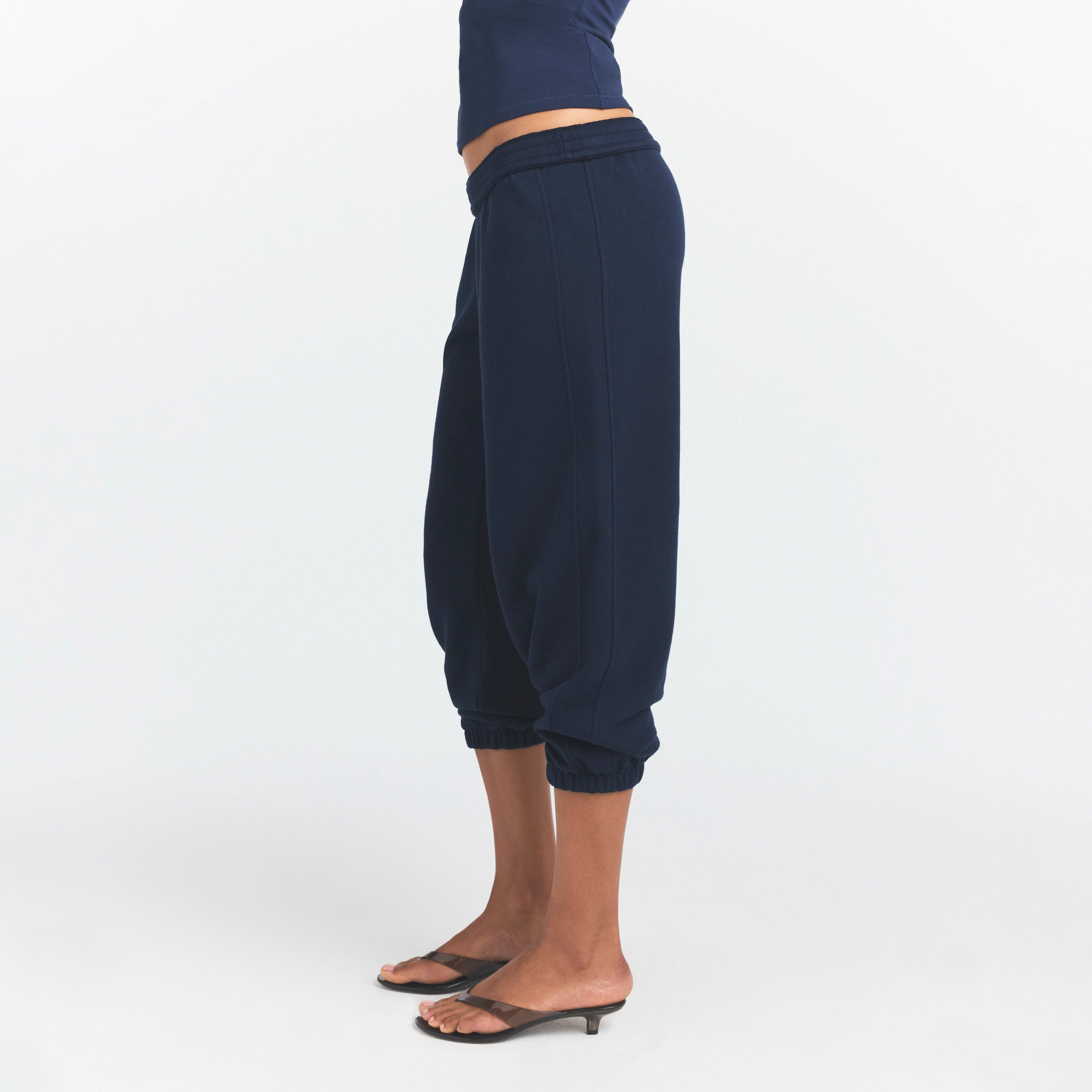 DRAPEY FRENCH TERRY CROPPED JOGGER | NAVY ON A MODEL SIDE VIEW @ | FOCUS: 0.0, 1.0, 0.9